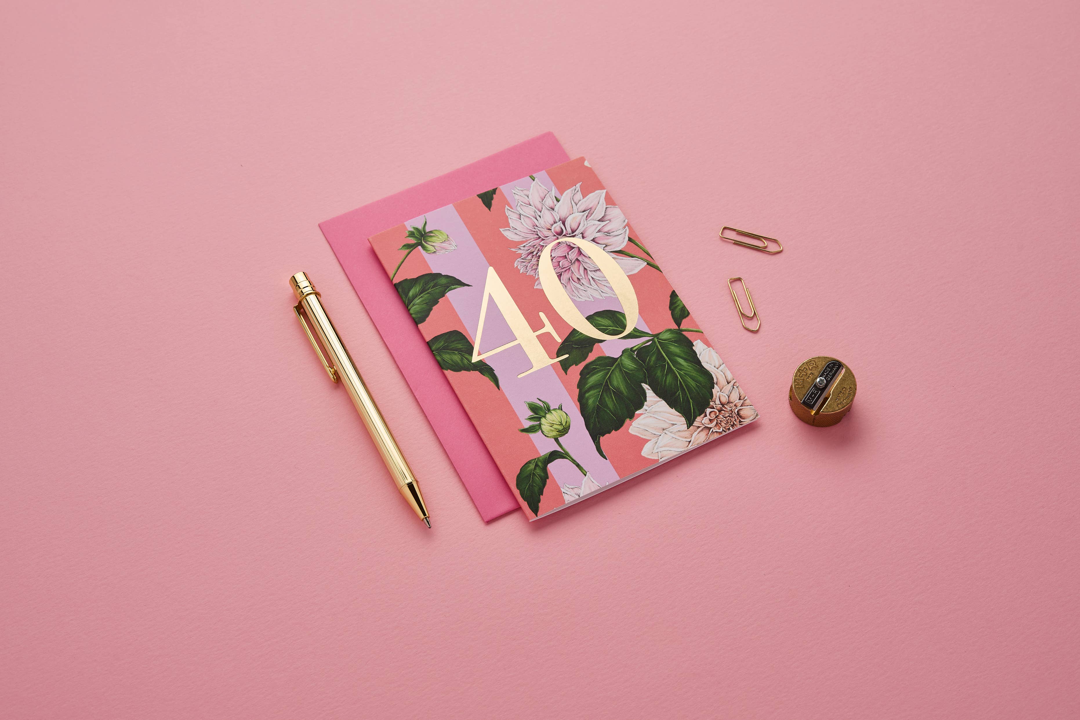 Floral notebook with number 40 on a pink background.
