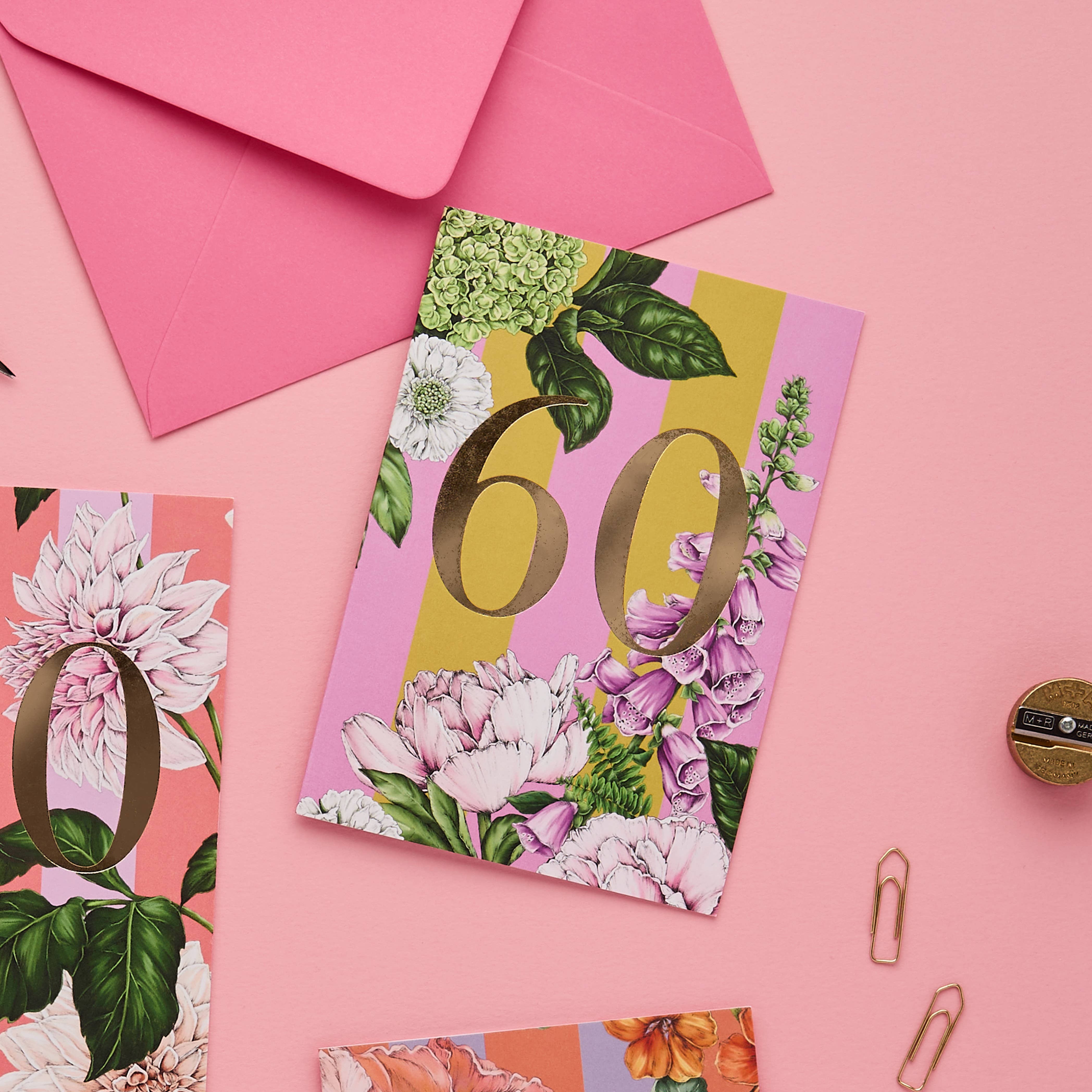 Floral card with number 60 on a pink background.
