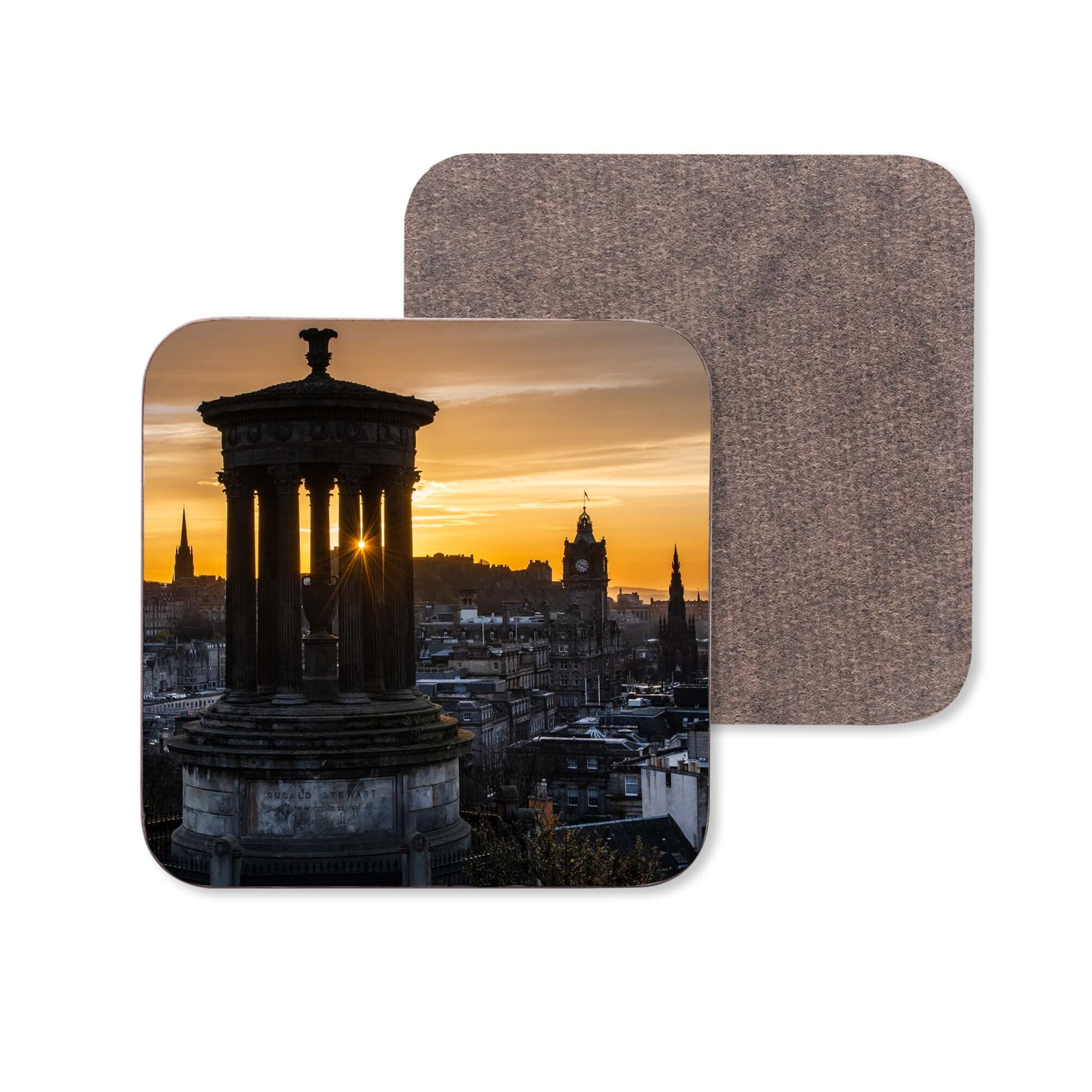 An image of the Edinburgh skyline at sunset on a coaster.