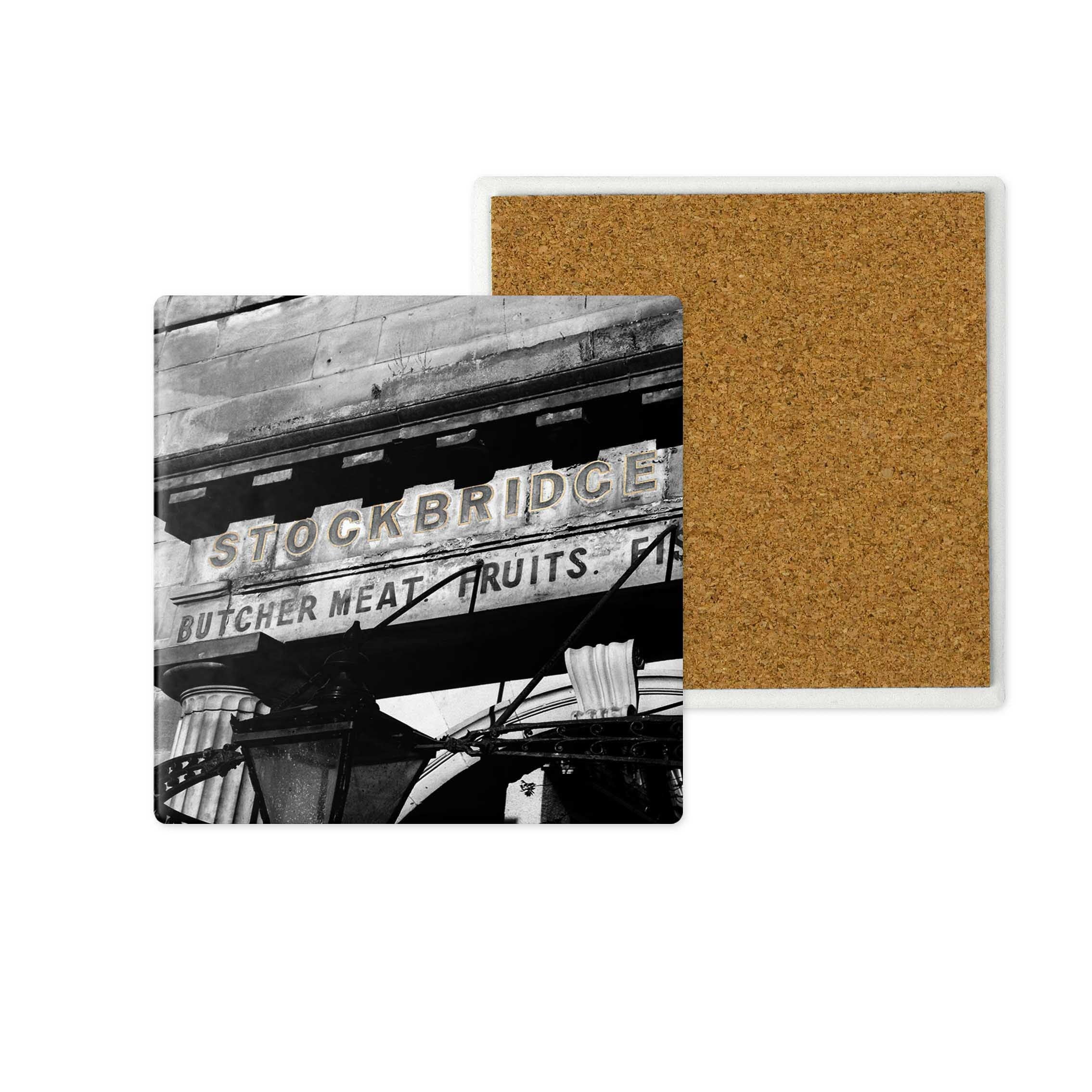 A close up of the Stockbridge Edinburgh Market sign on a ceramic coaster.