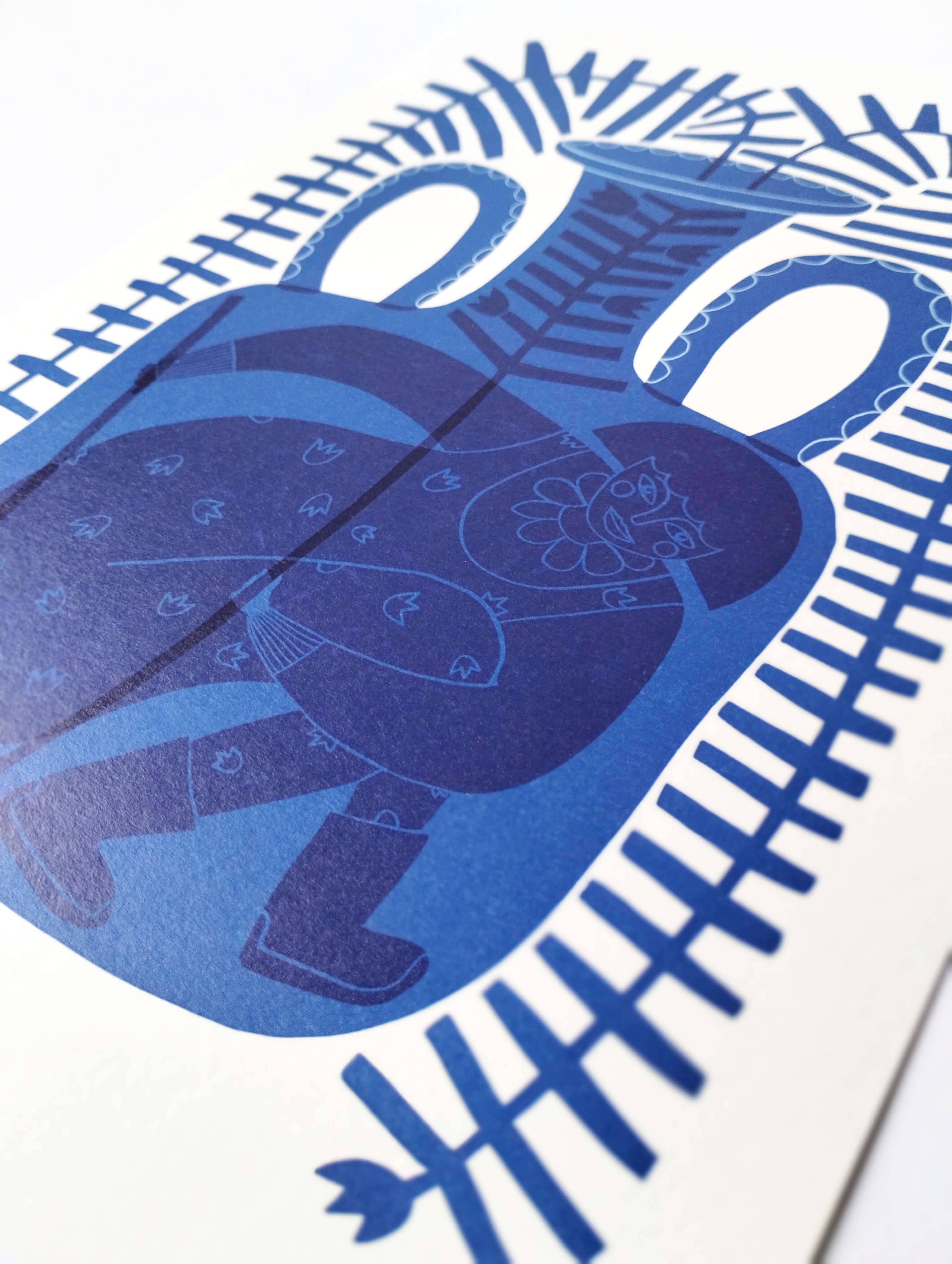 Blue vase are print with a patterned background.