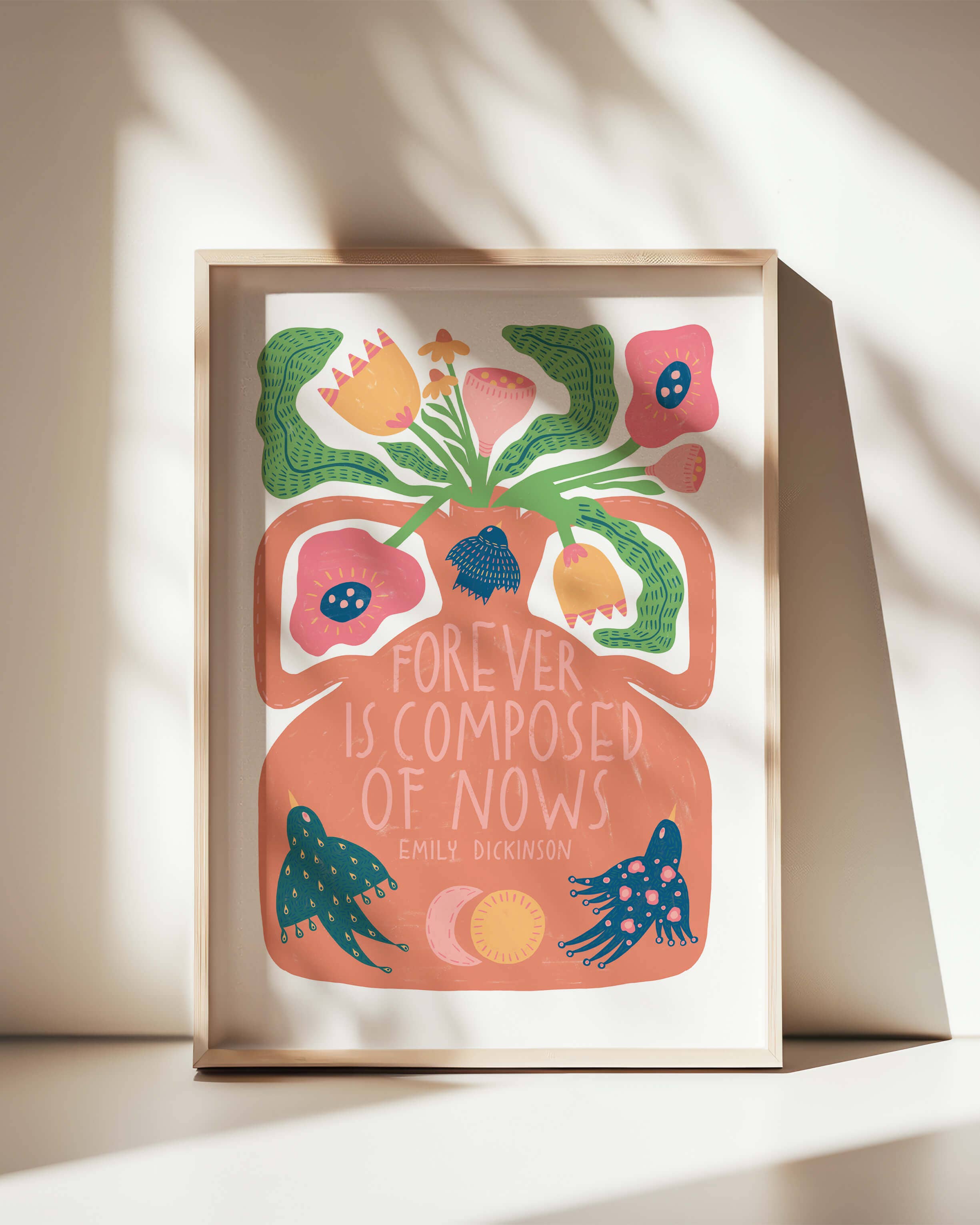 Framed artwork with floral design and text on a light background.
