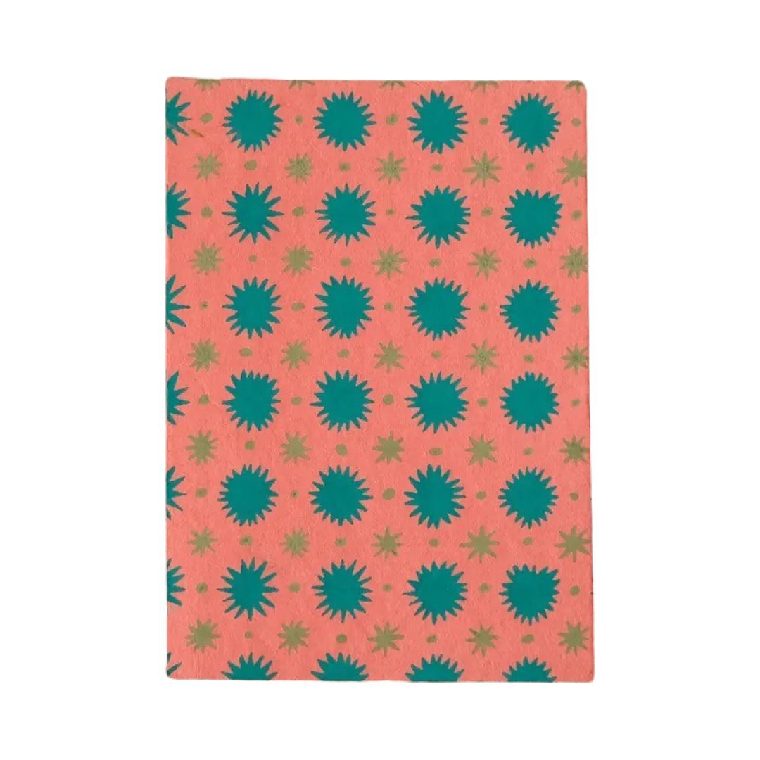 A6 pink scrapbook with teal and green stars.