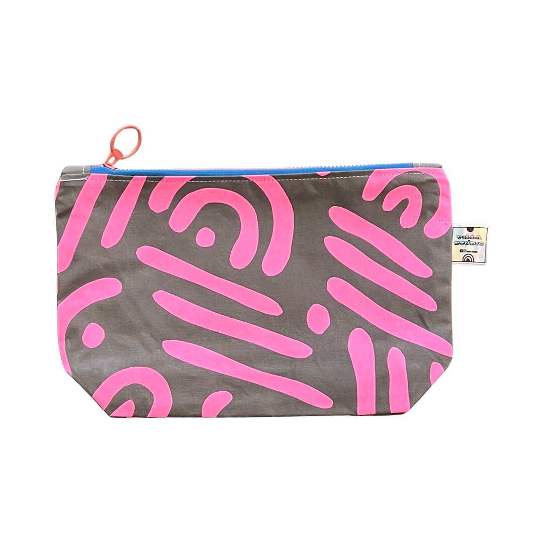 Pink and grey cosmetic bag in an abstract design.