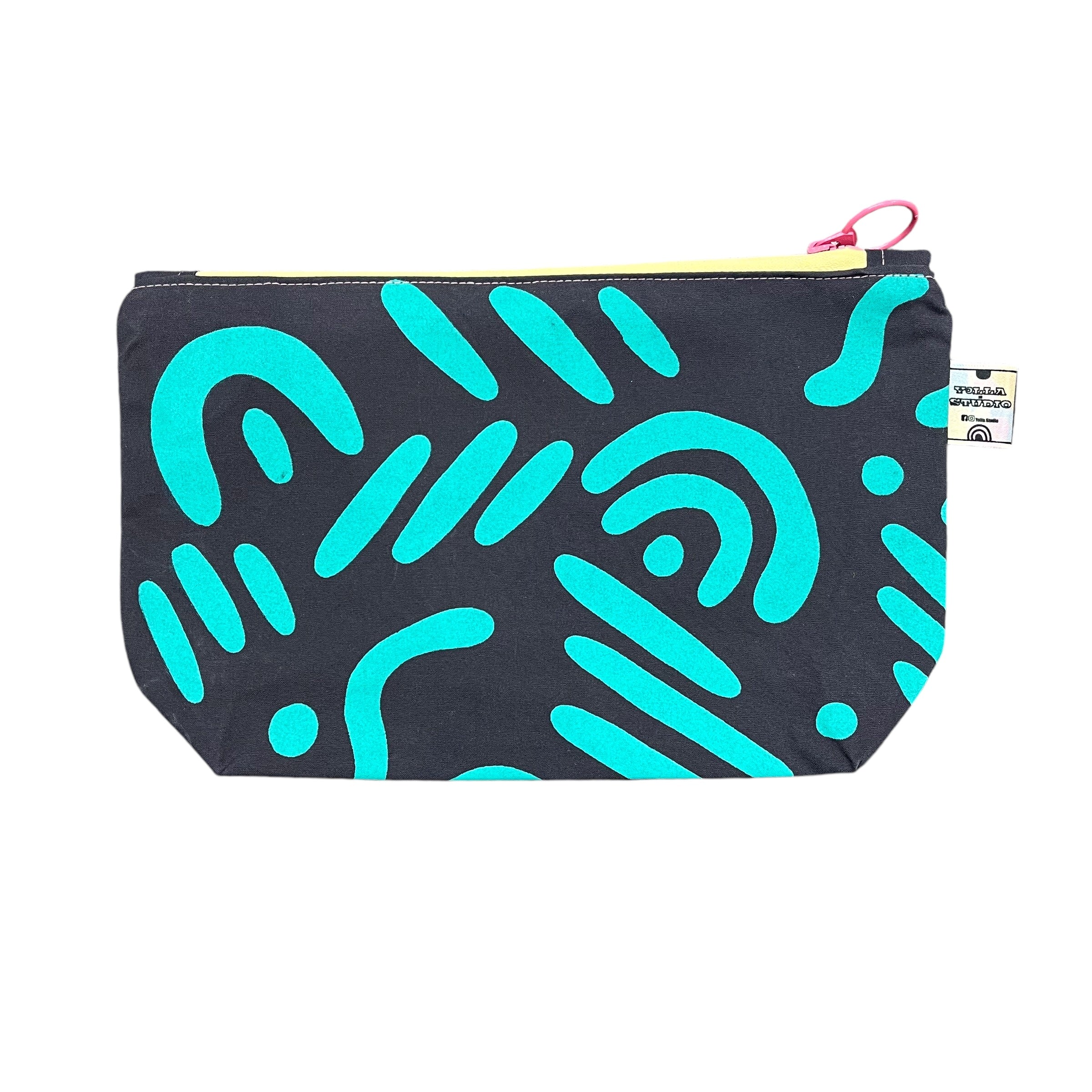 Turquoise small cosmetic bag in abstract pattern.