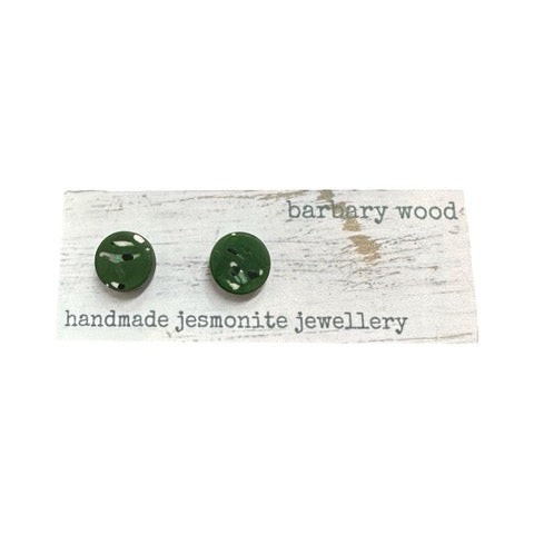 Green round stud earrings with a black and white abstract pattern.