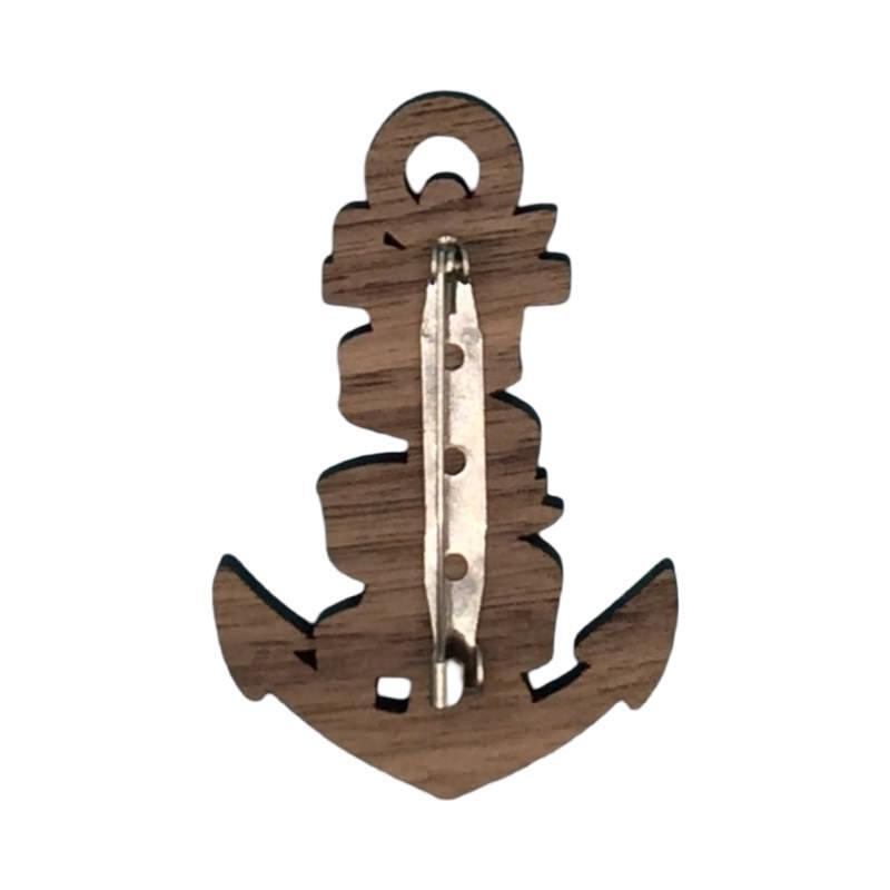 The back of an anchor-shaped wooden brooch.
