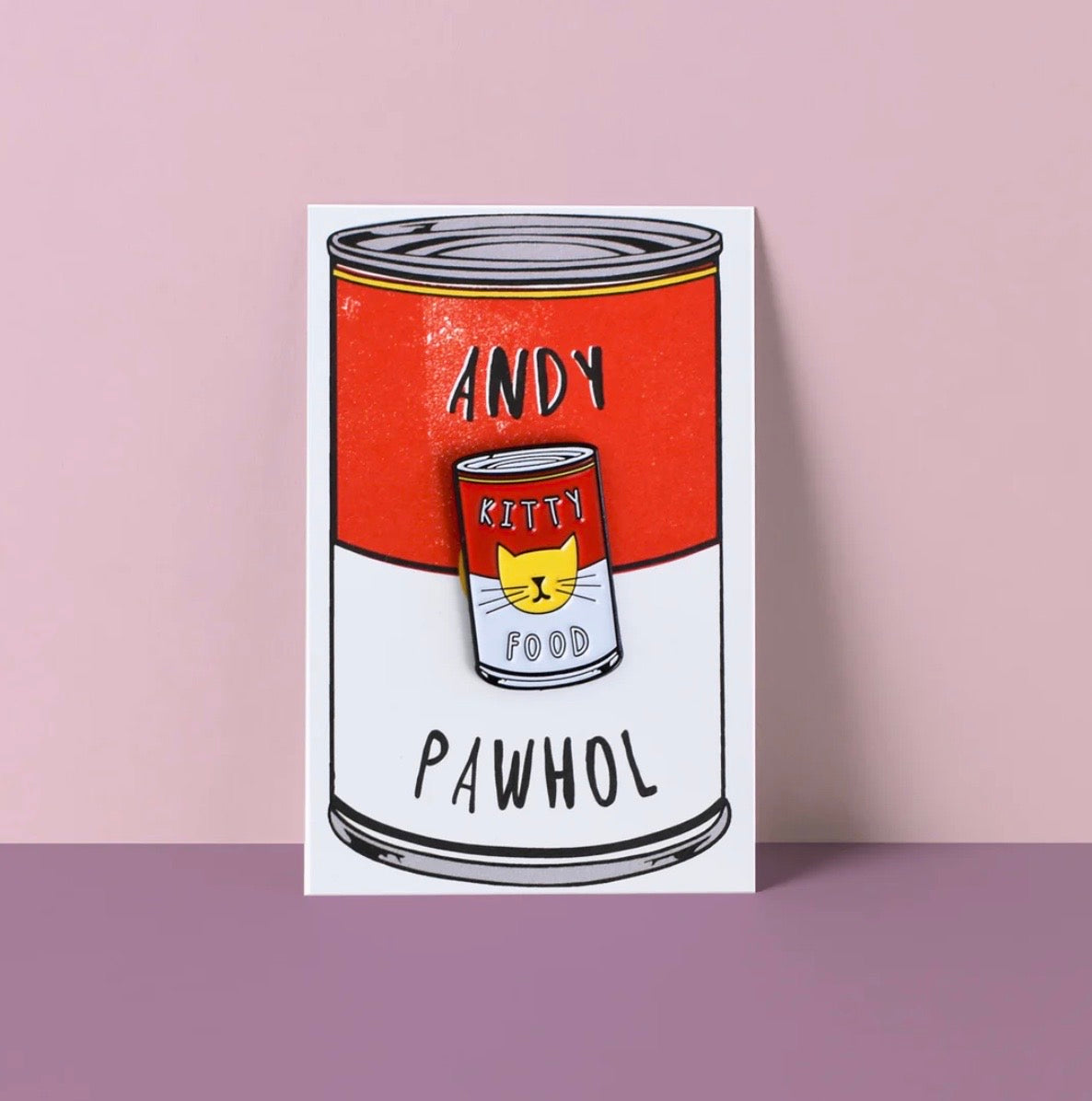 Illustration of a red and white can pin labeled 'Andy Kitty Food Pawhol' on a pink background.