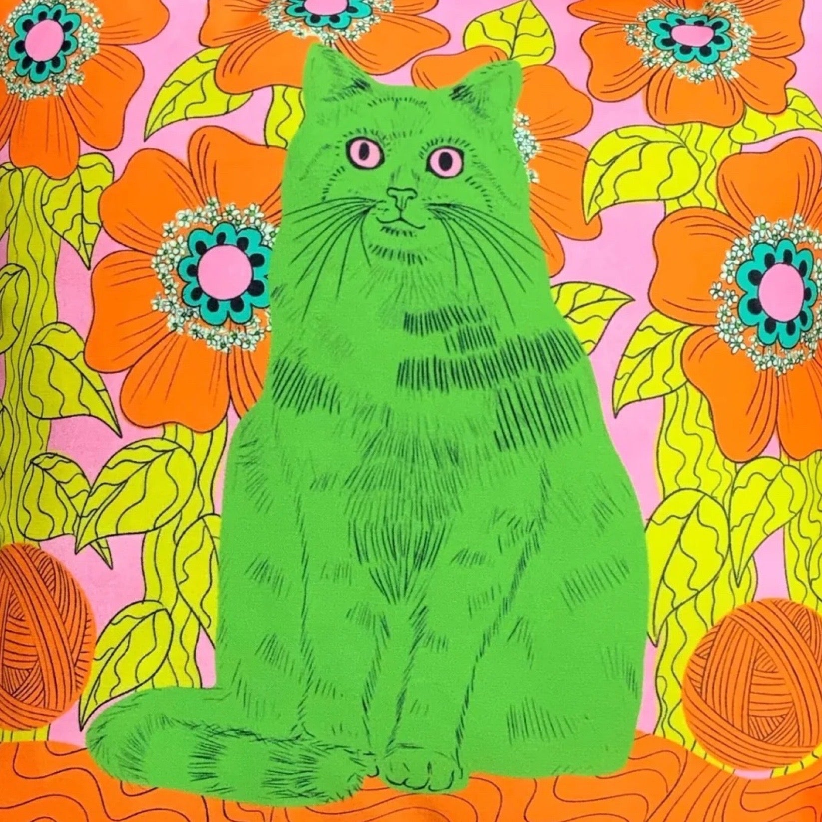 Green cat illustration on a colourful floral and yarn background.