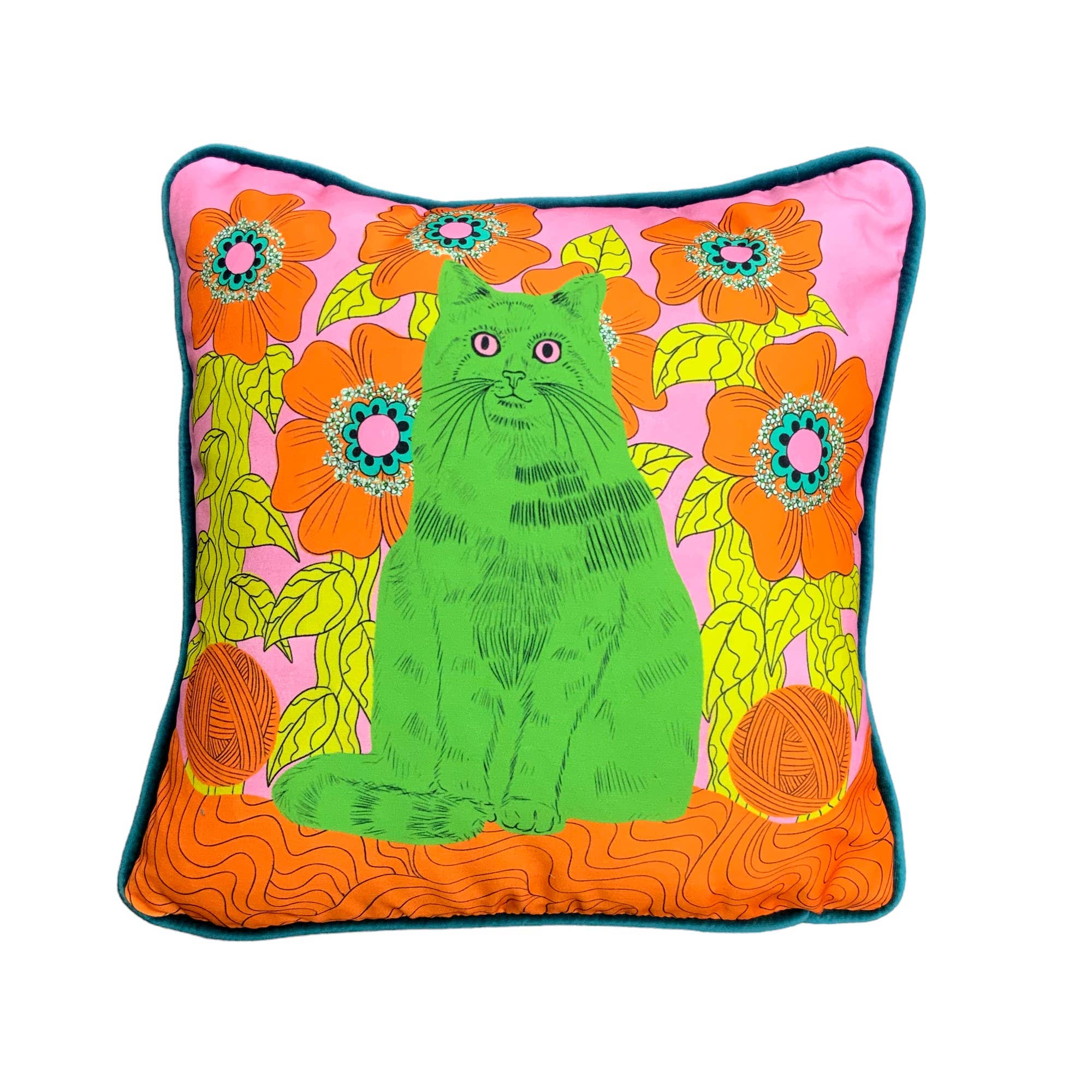 Colourful cushion featuring a green cat (called Andy!) against an orange, yellow and pink floral background. The cushion is trimmed with handmade velvet piping and backed with luxurious orange velvet.