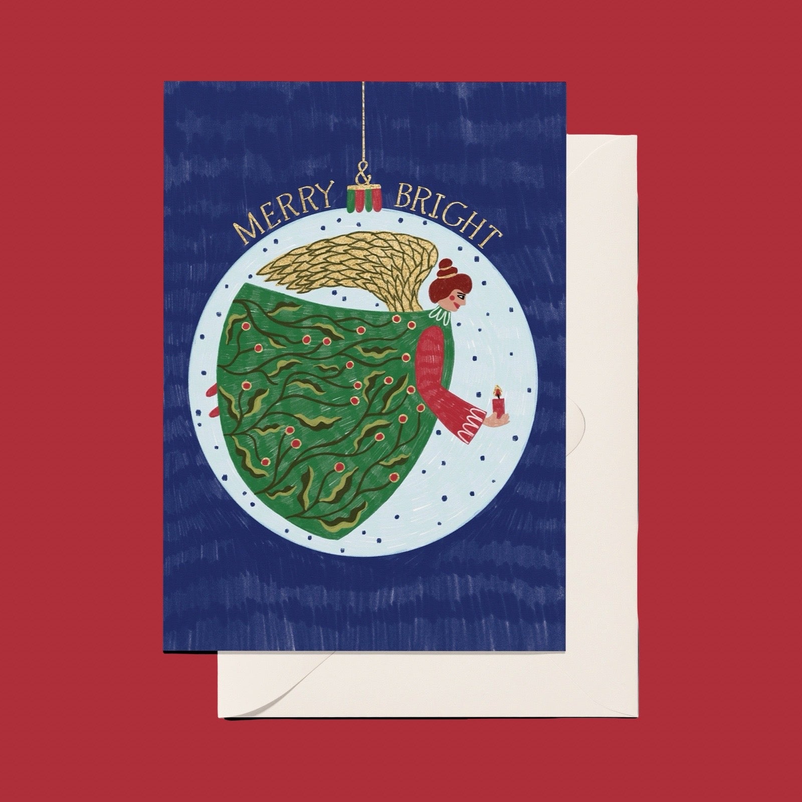 A Christmas greeting card featuring an illustration of a woman in a green dress inside a snow globe, with the words 'MERRY & BRIGHT' above, shown with a white envelope on a red background.