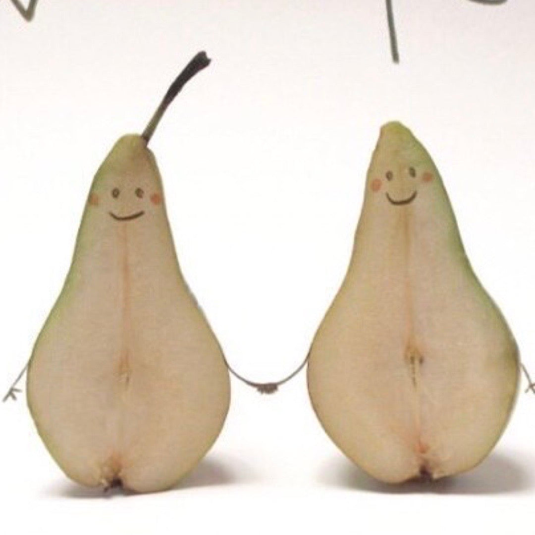 Two pears with smiling faces on a white background.