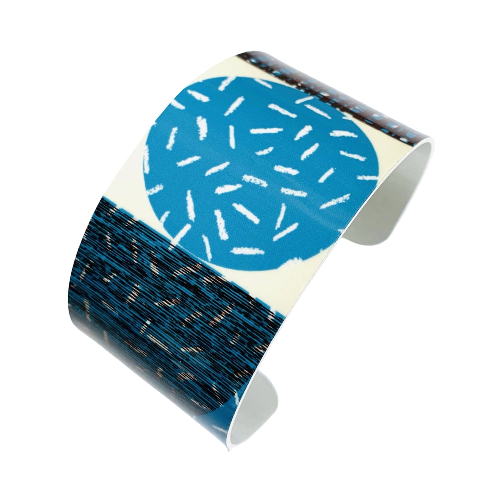 Cylindrical object with blue circular design on a white background.