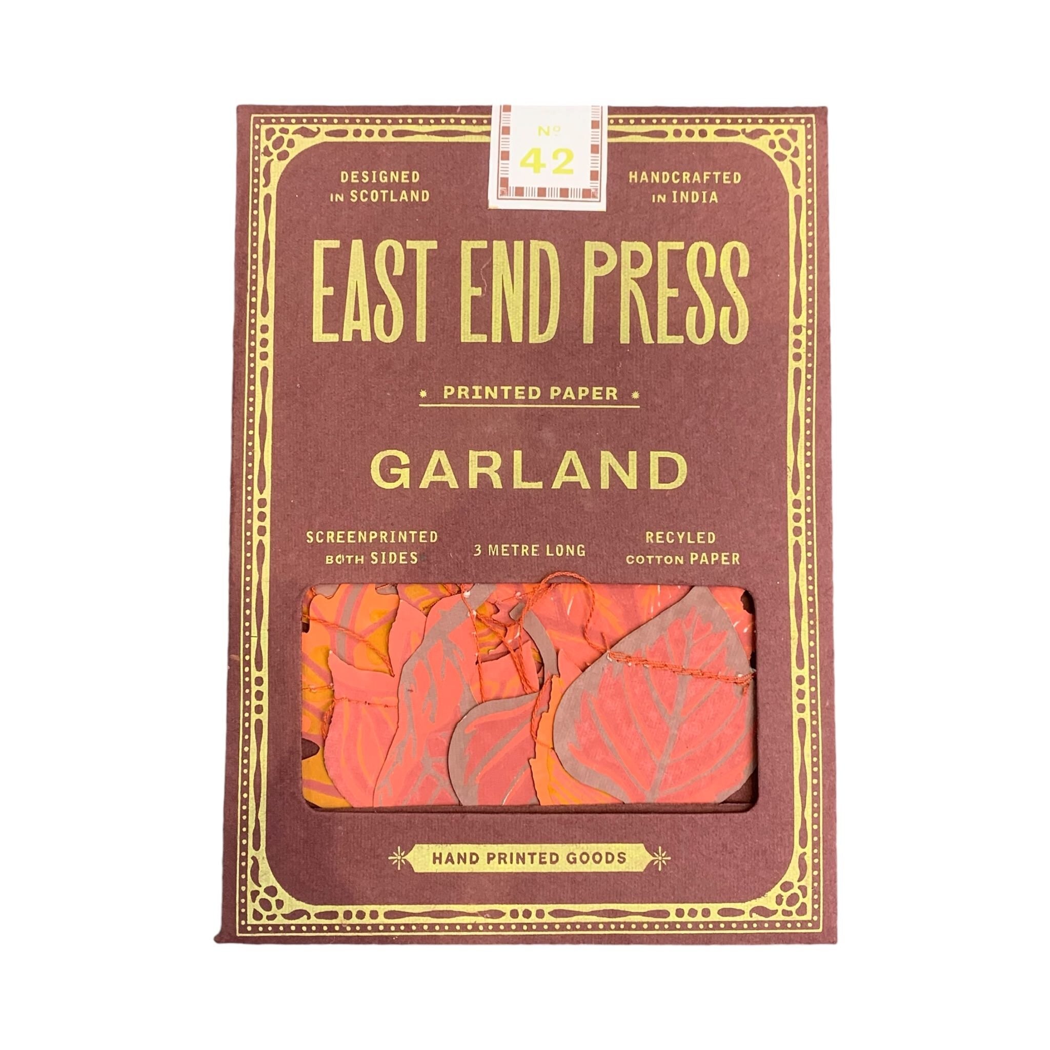 A brown paper packet of an autumn leaves paper garland.