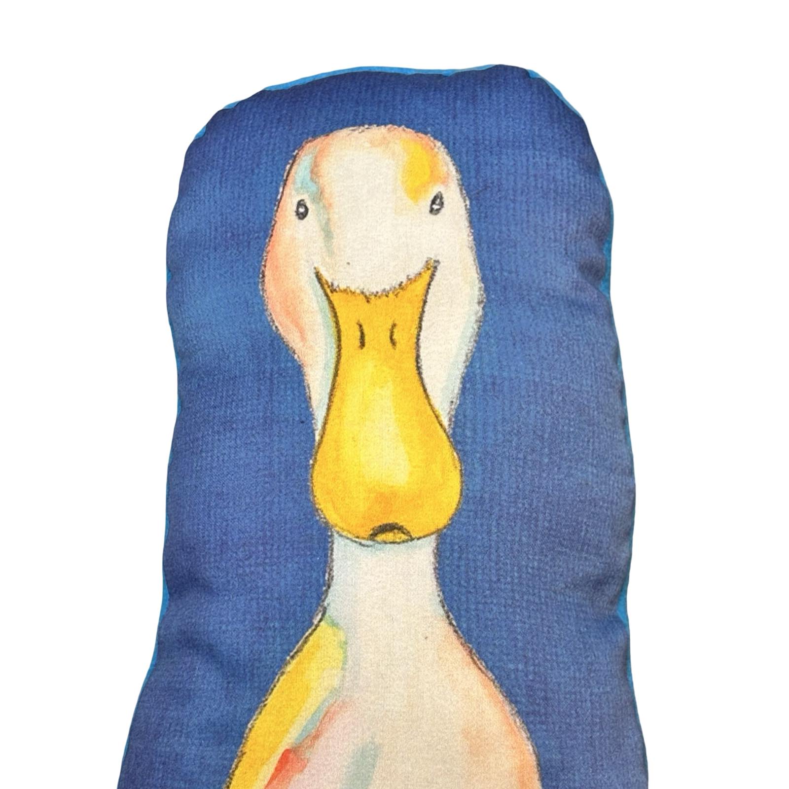 Decorative pillow with a duck design on a blue background.
