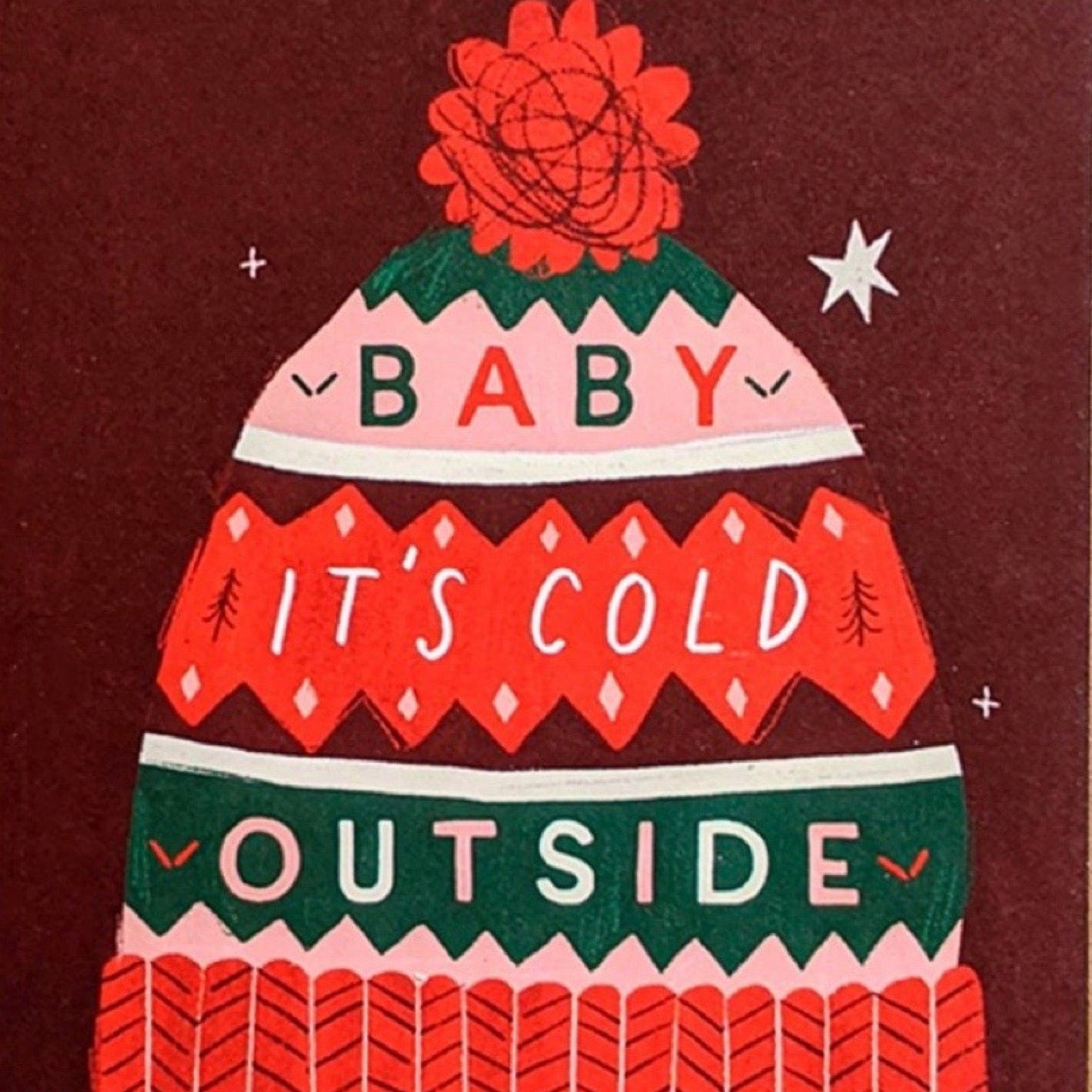 Greeting card with a winter bobble hat design on a brown background.
