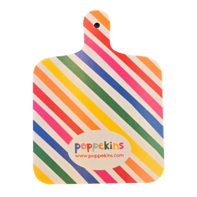 Multicoloured striped back of vegetable chopping board.