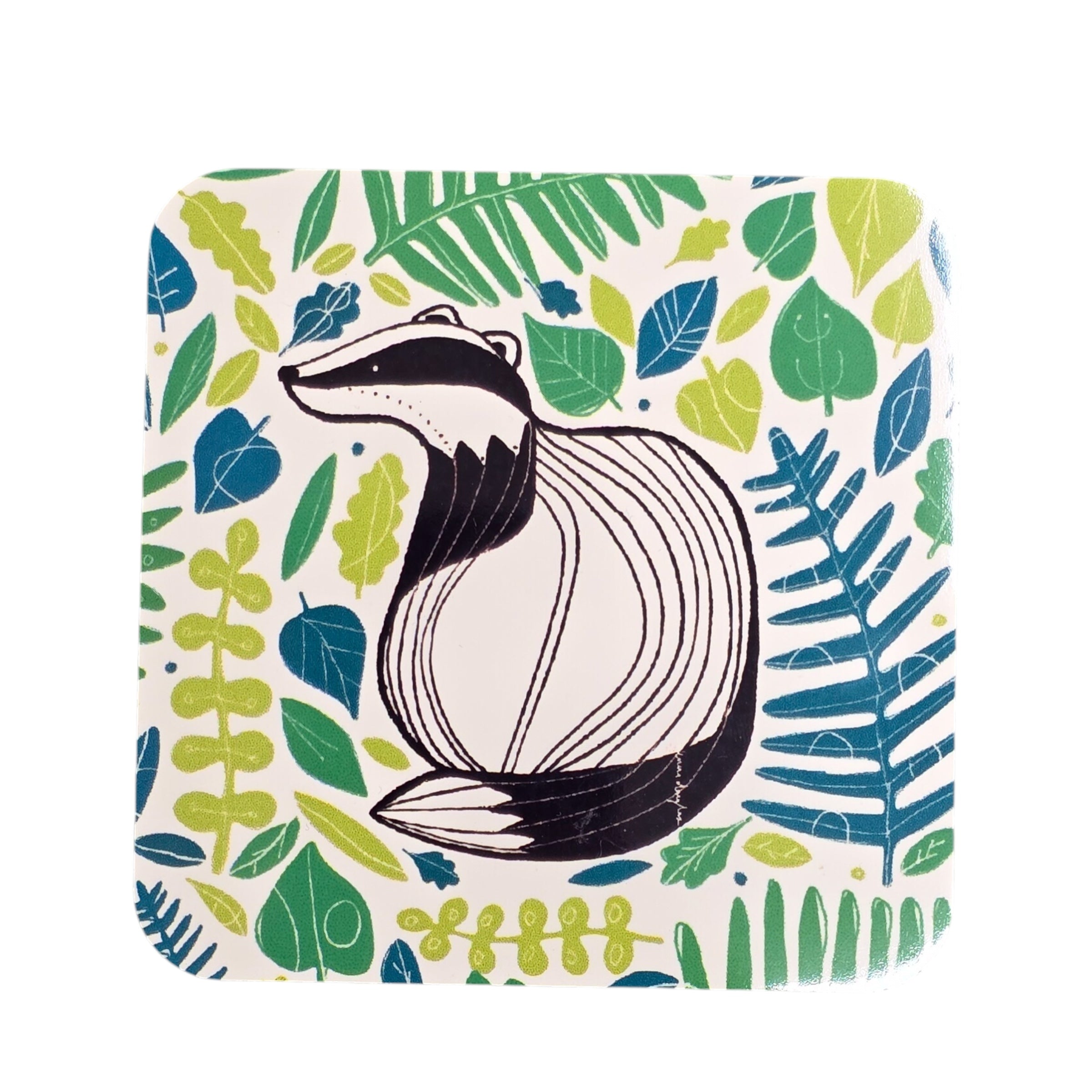 An image of a coaster with an illustration of a badger surrounded by green leaves.