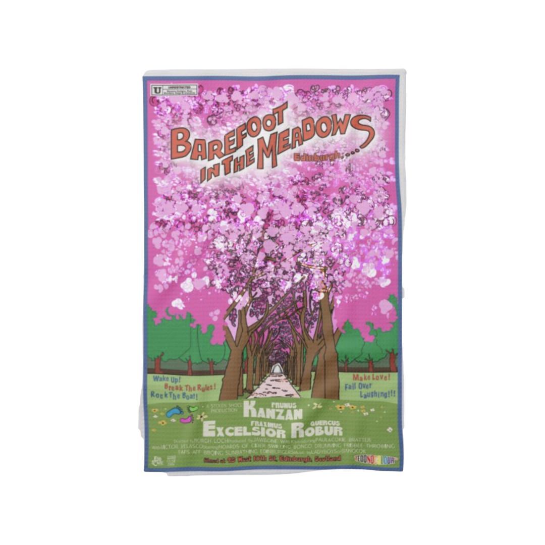 Tea towel featuring a movie poster design with an original illustration of the Meadows in Edinburgh with the cherry blossom trees in full bloom