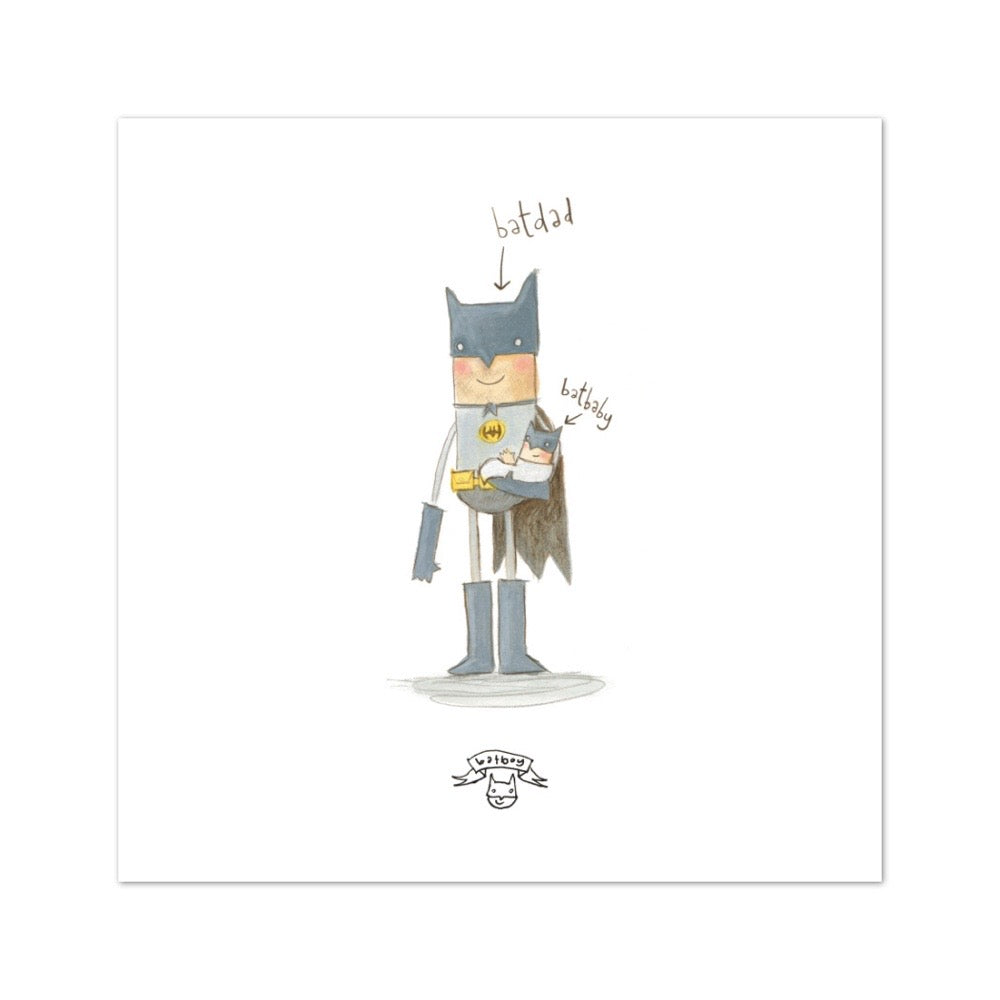 Batman holding a Batbaby, both labelled by arrows.