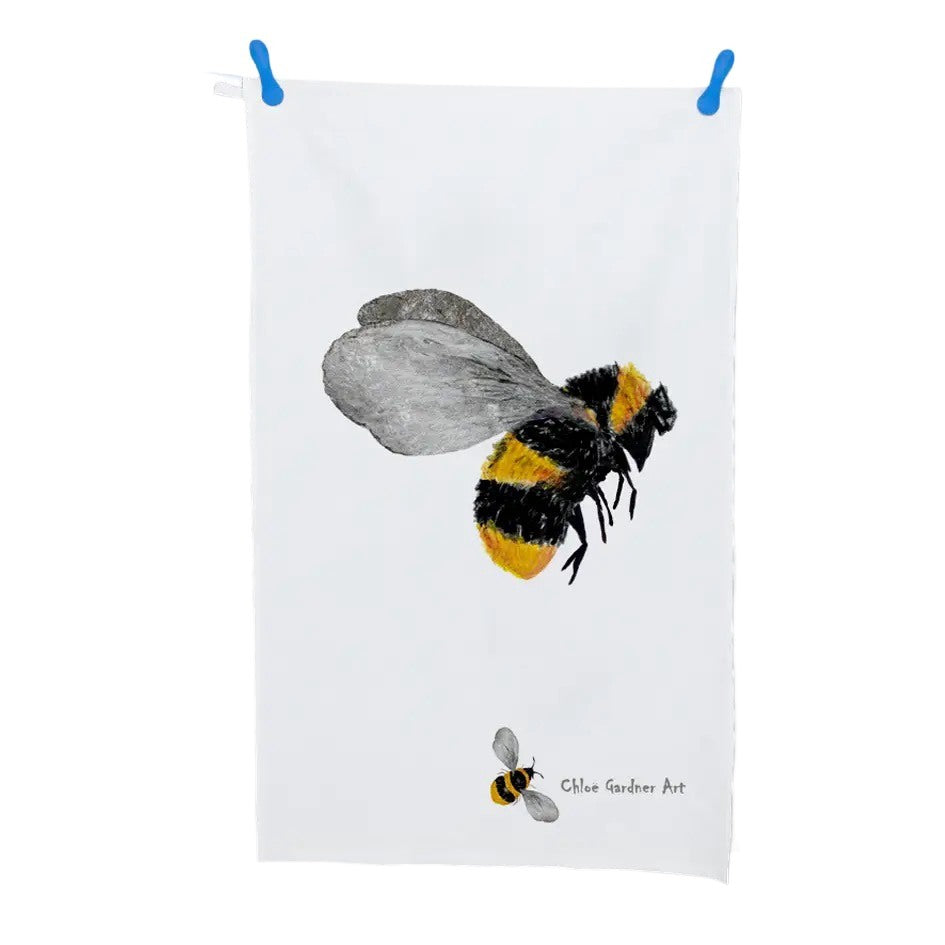 A picture of an illustrated bee on a white tea towel.