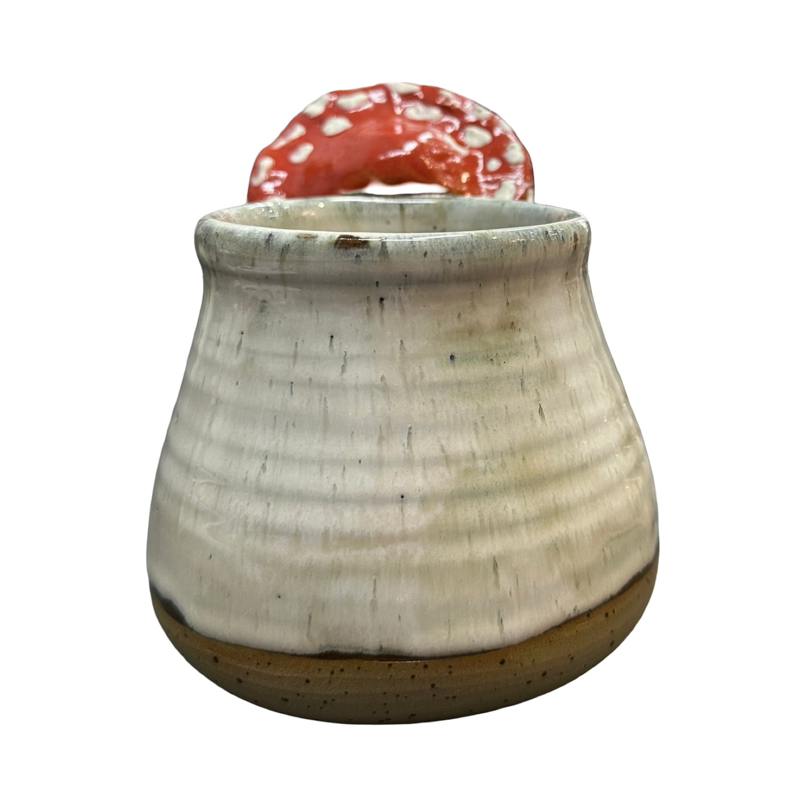 Ceramic mug with a mushroom handle on a white background.