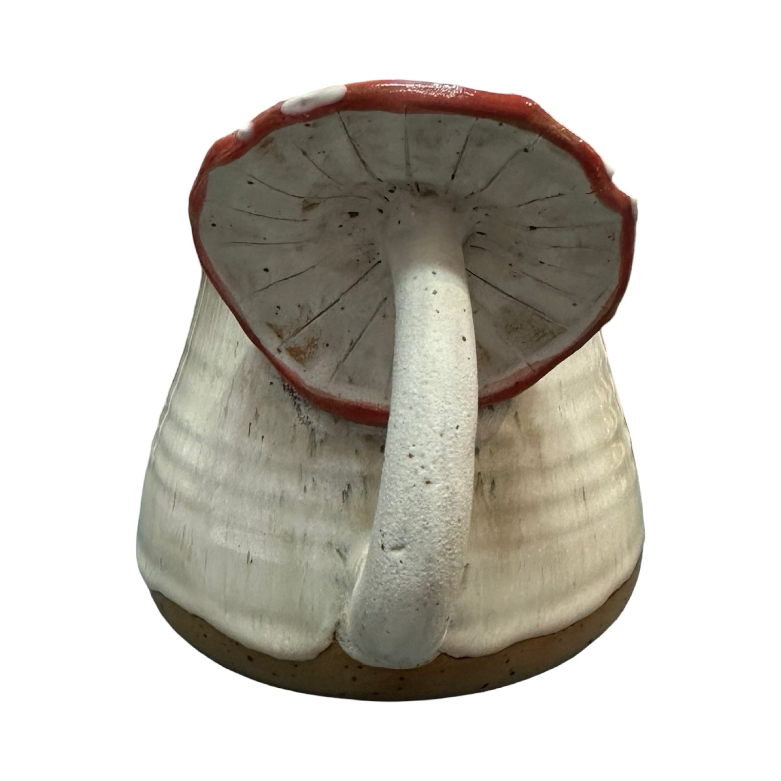 Ceramic mug with mushroom handle on a white background.