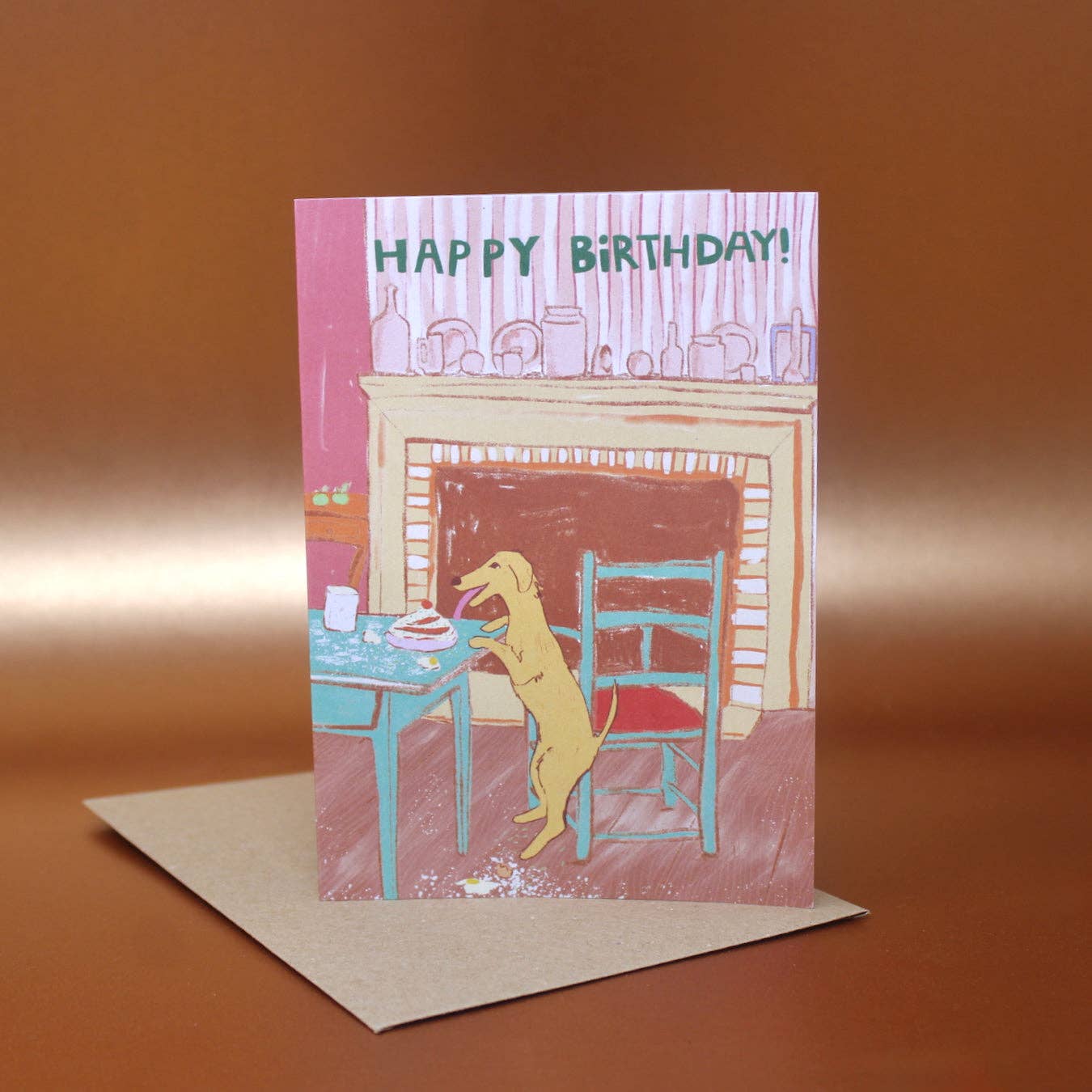Birthday card with a dog at a table and 'Happy Birthday!' text, on an orange background.