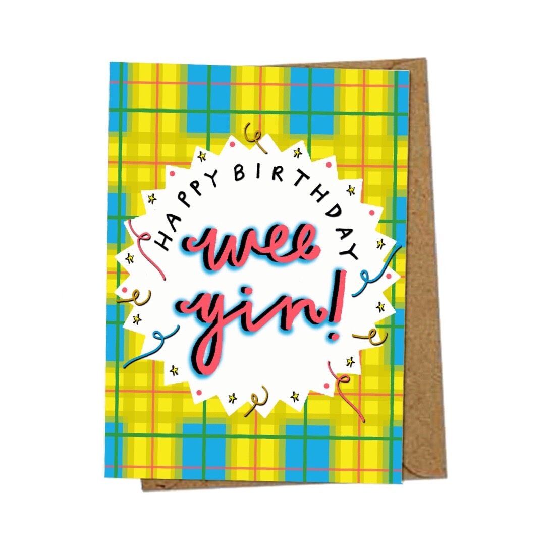 Birthday card with the text 'Happy Birthday Wee Yin' inside a white pointy-edged circle on a yellow and blue tartan background.