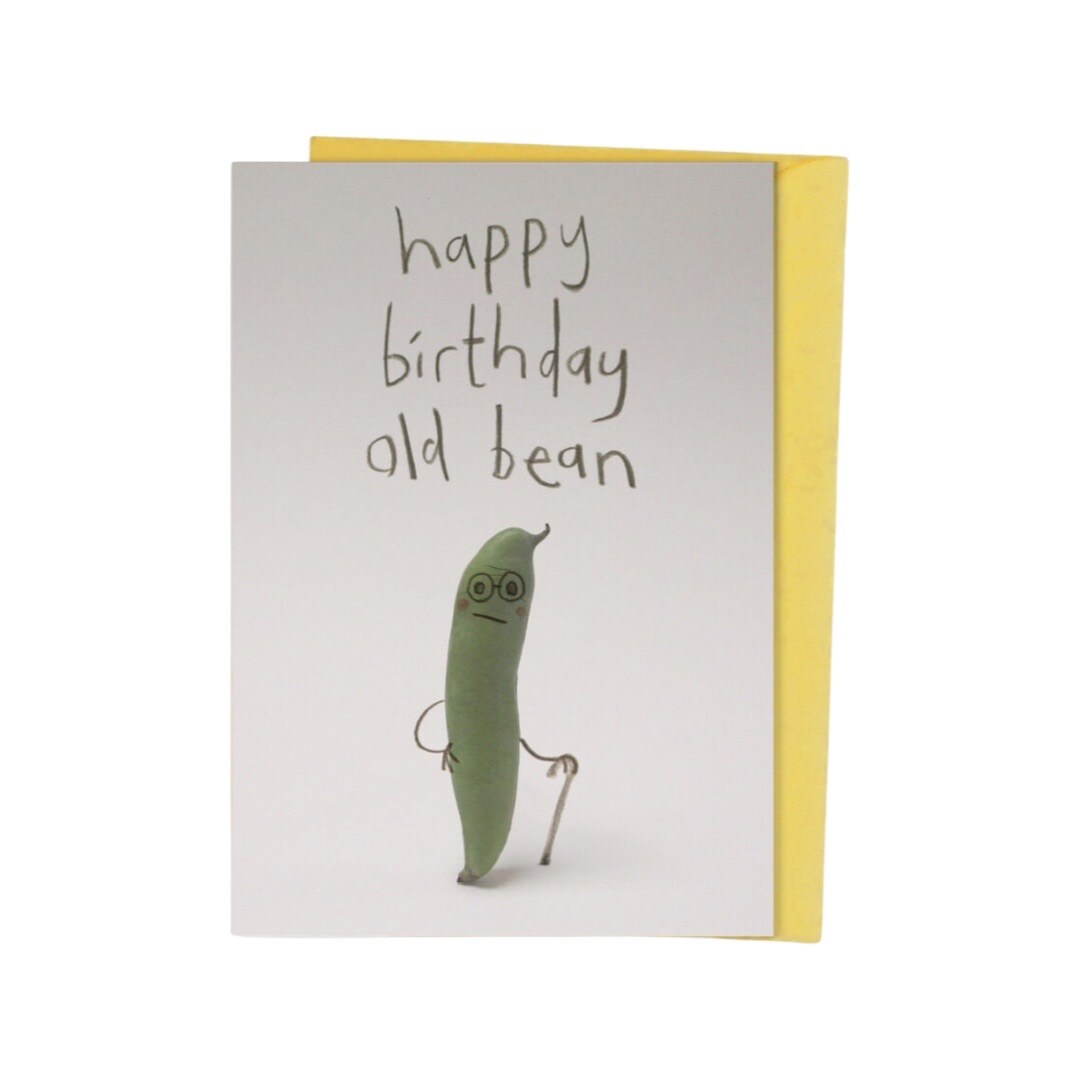 Birthday card with an illustration of a green bean holding a walking stick and the text 'Happy birthday old bean'