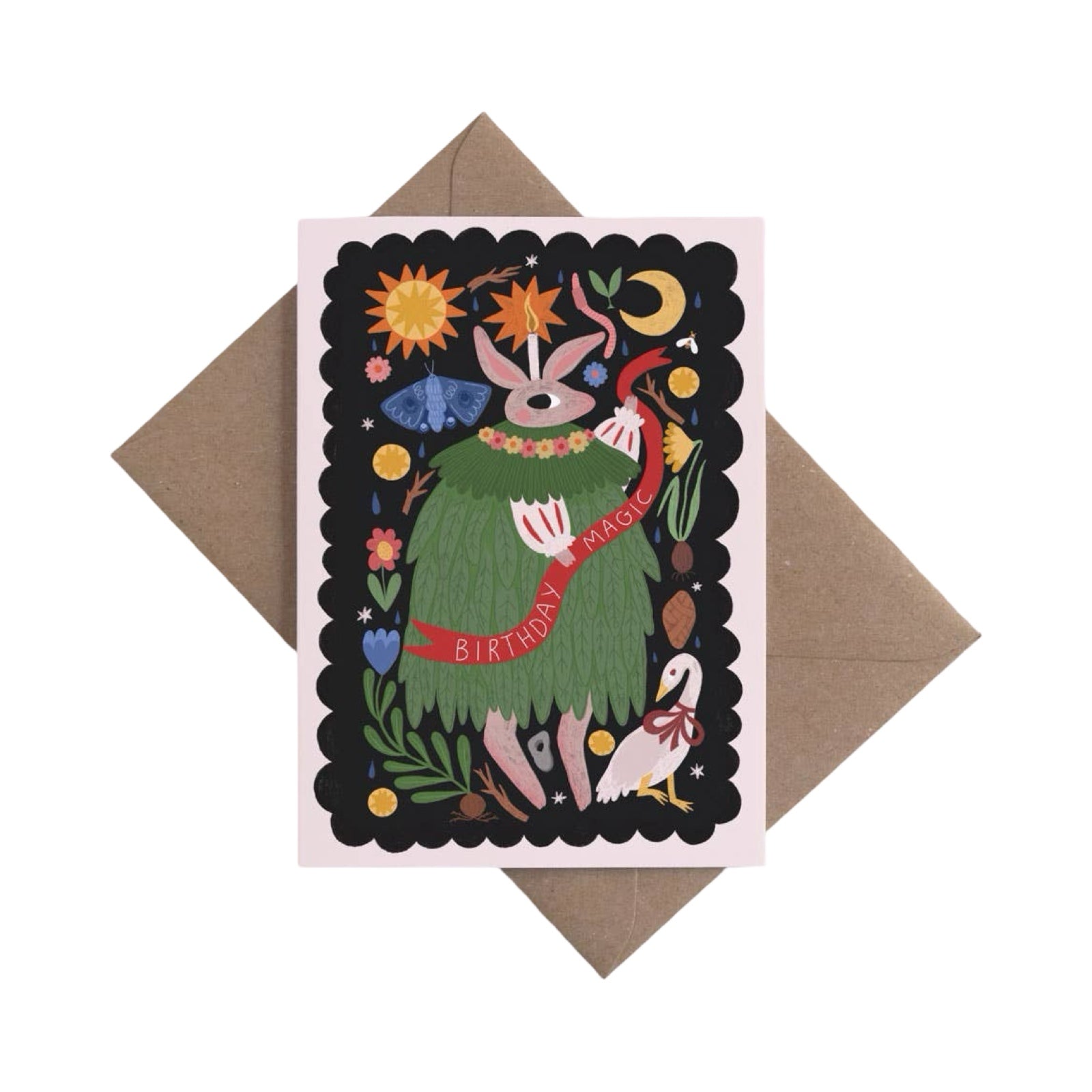 Greeting card with a colourful illustration of a character in a green dress, surrounded by celestial elements and a brown envelope.