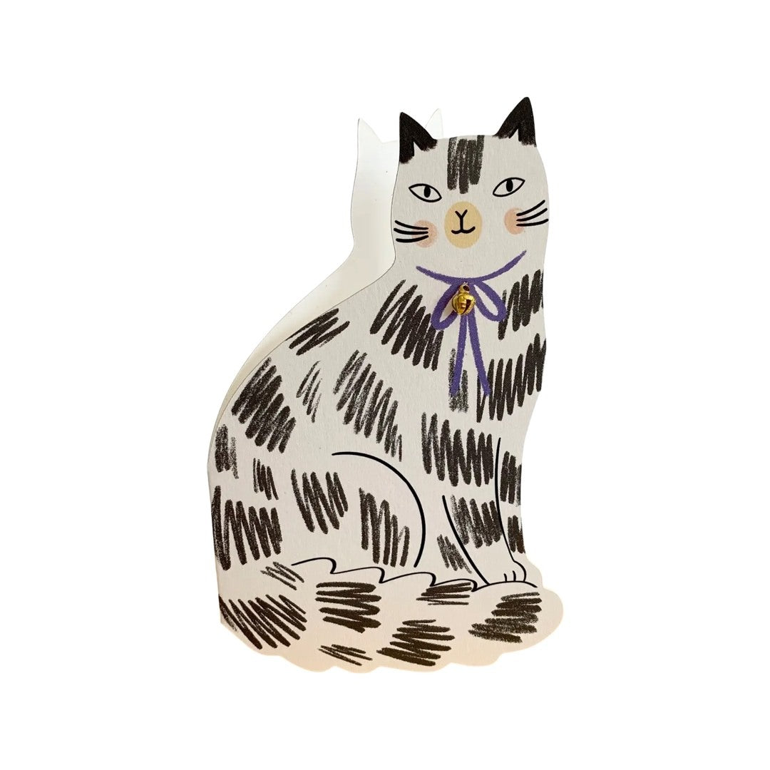 An adorable cat-shaped card of a sitting white cat with black markings.