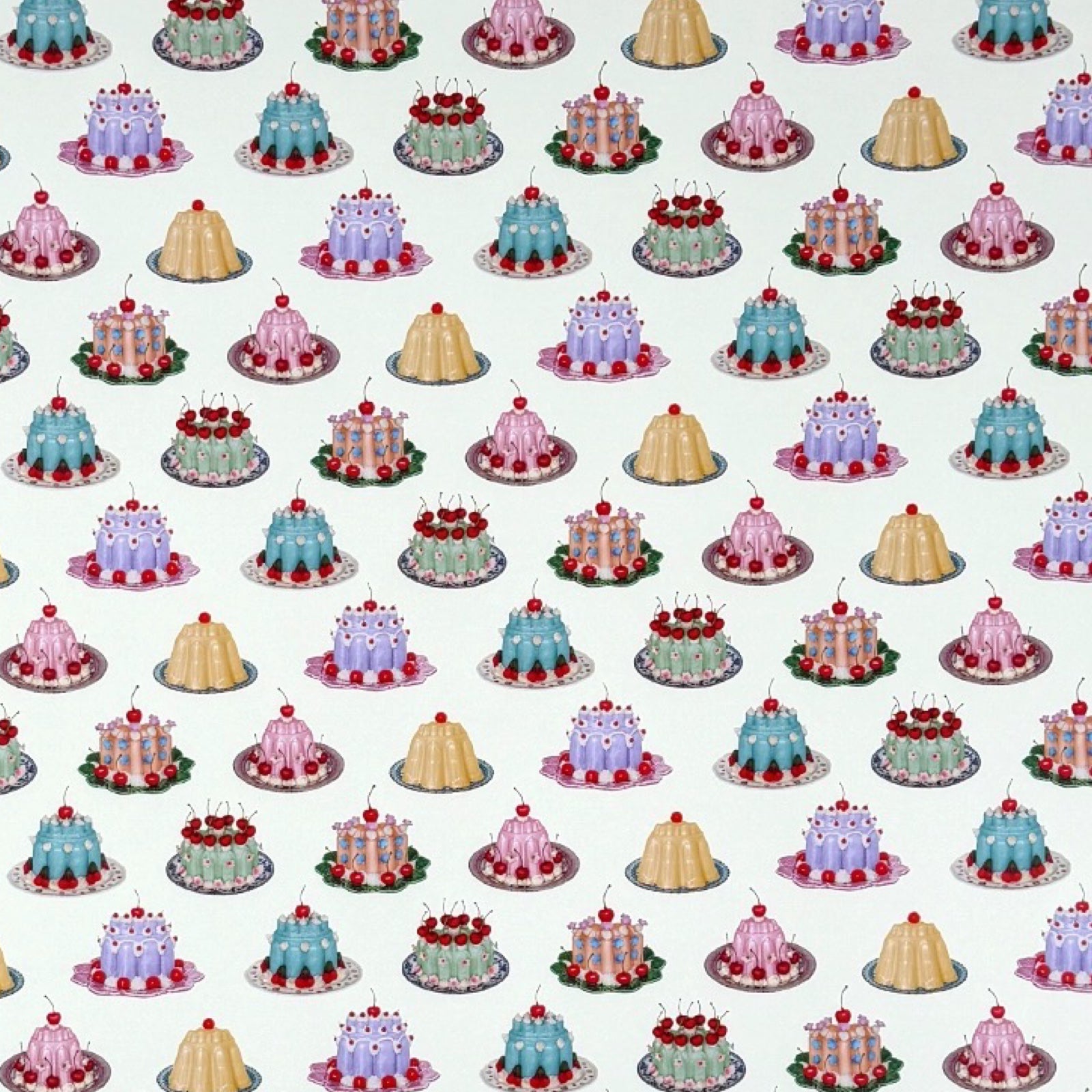 Pattern of small cakes on a light blue background.