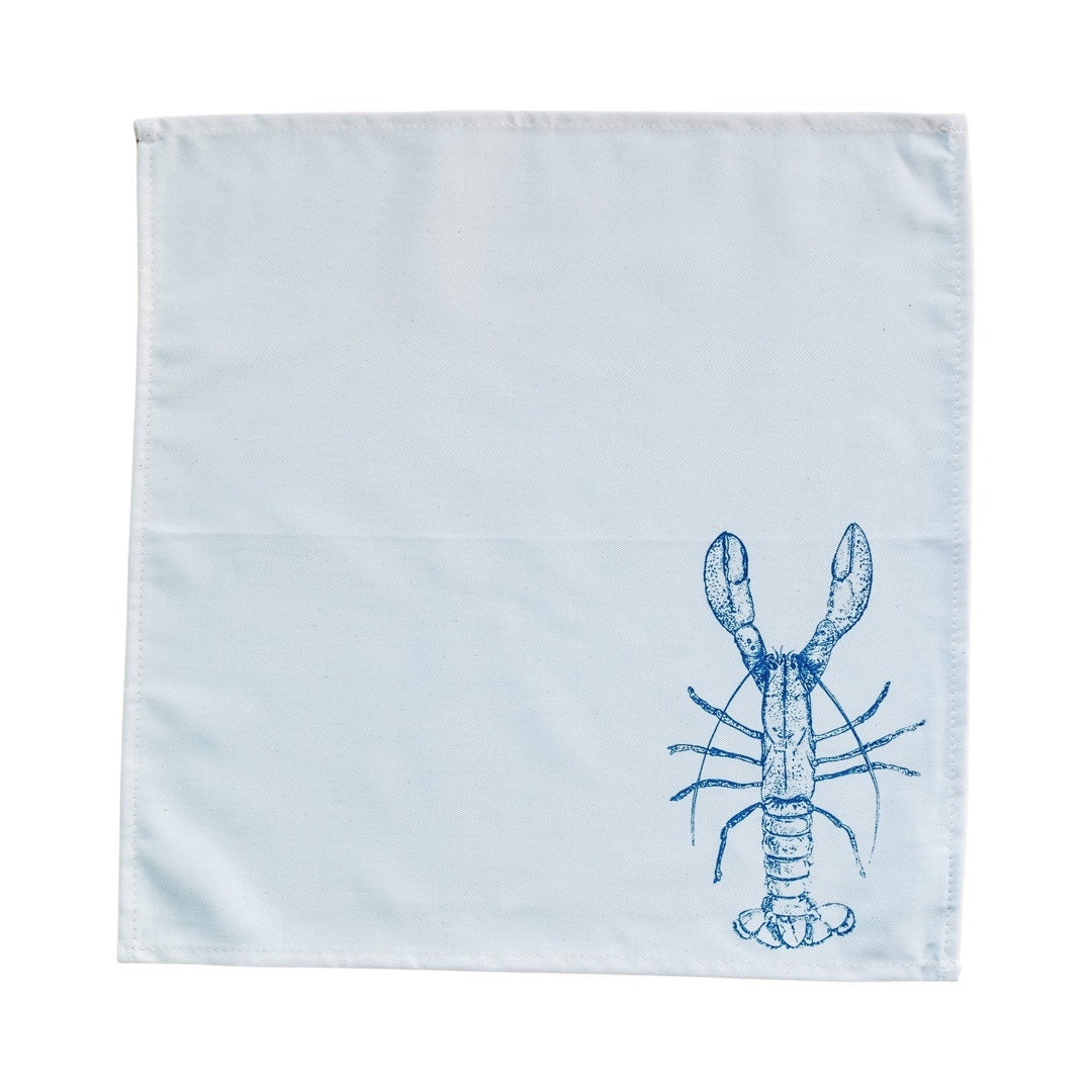 Cream cotton napkin with a blue lobster open.