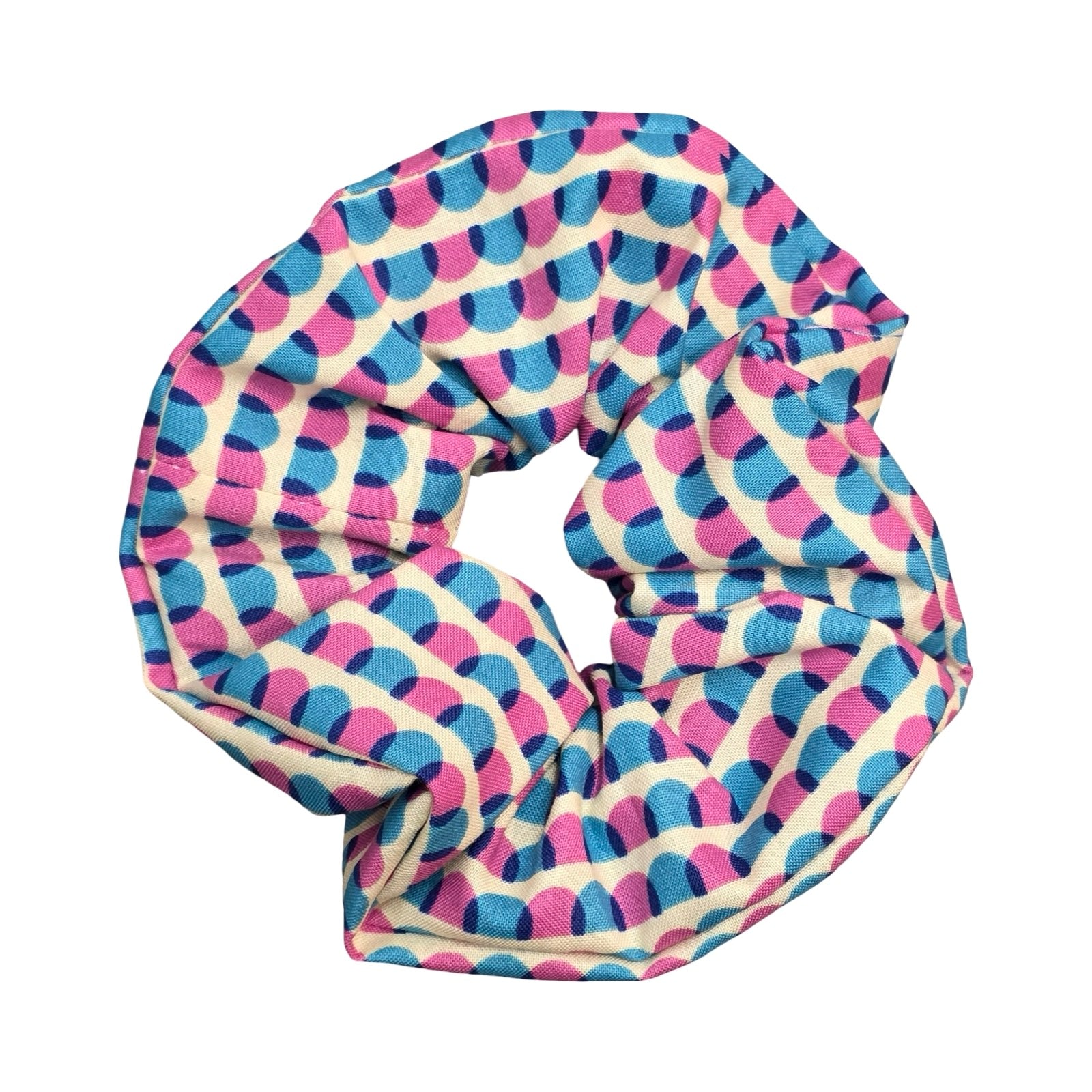 This handmade hair scrunchie is made from 100% cotton fabric with a blue and pink scalloped pattern.