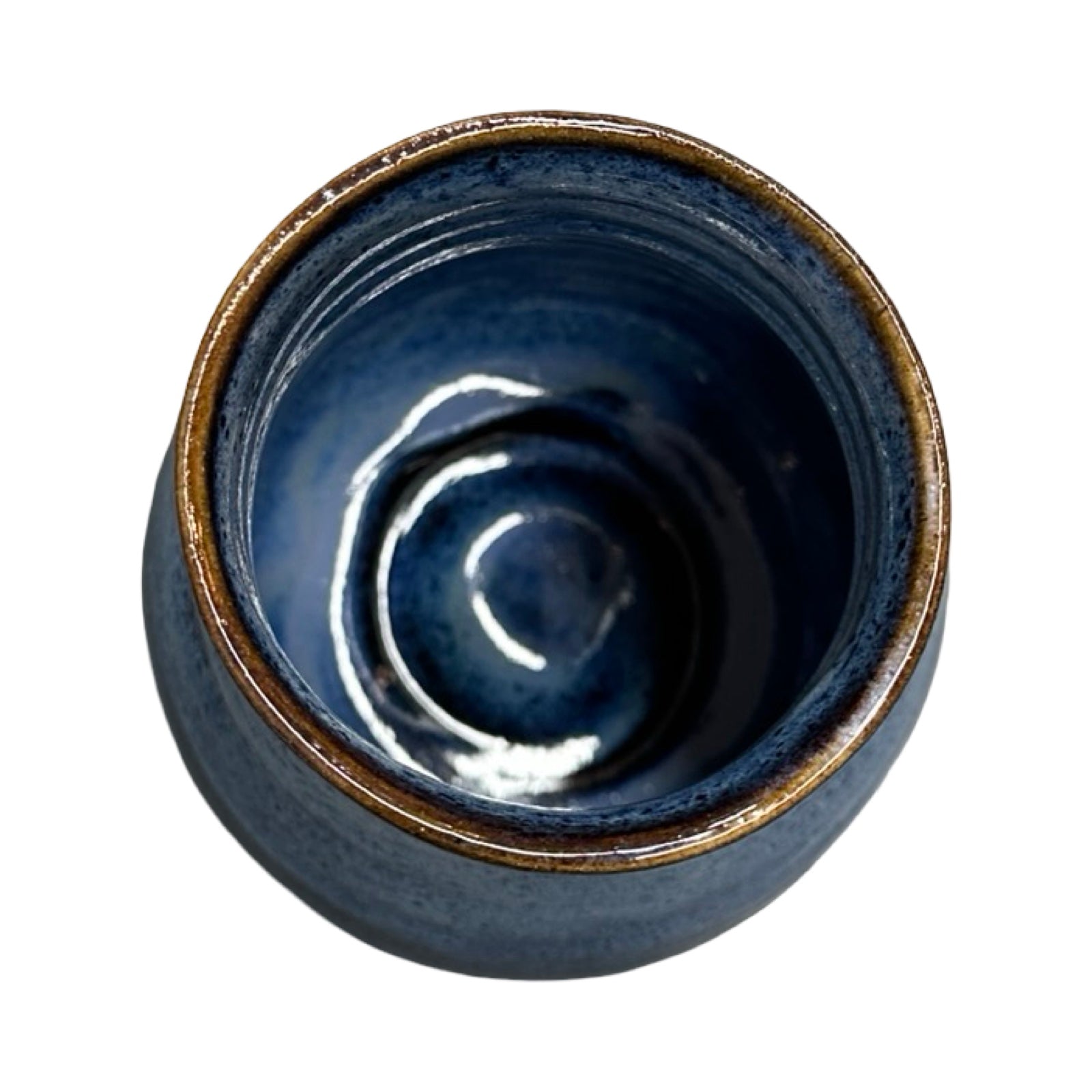 Top view of a blue ceramic vase with brown rim on a white background.