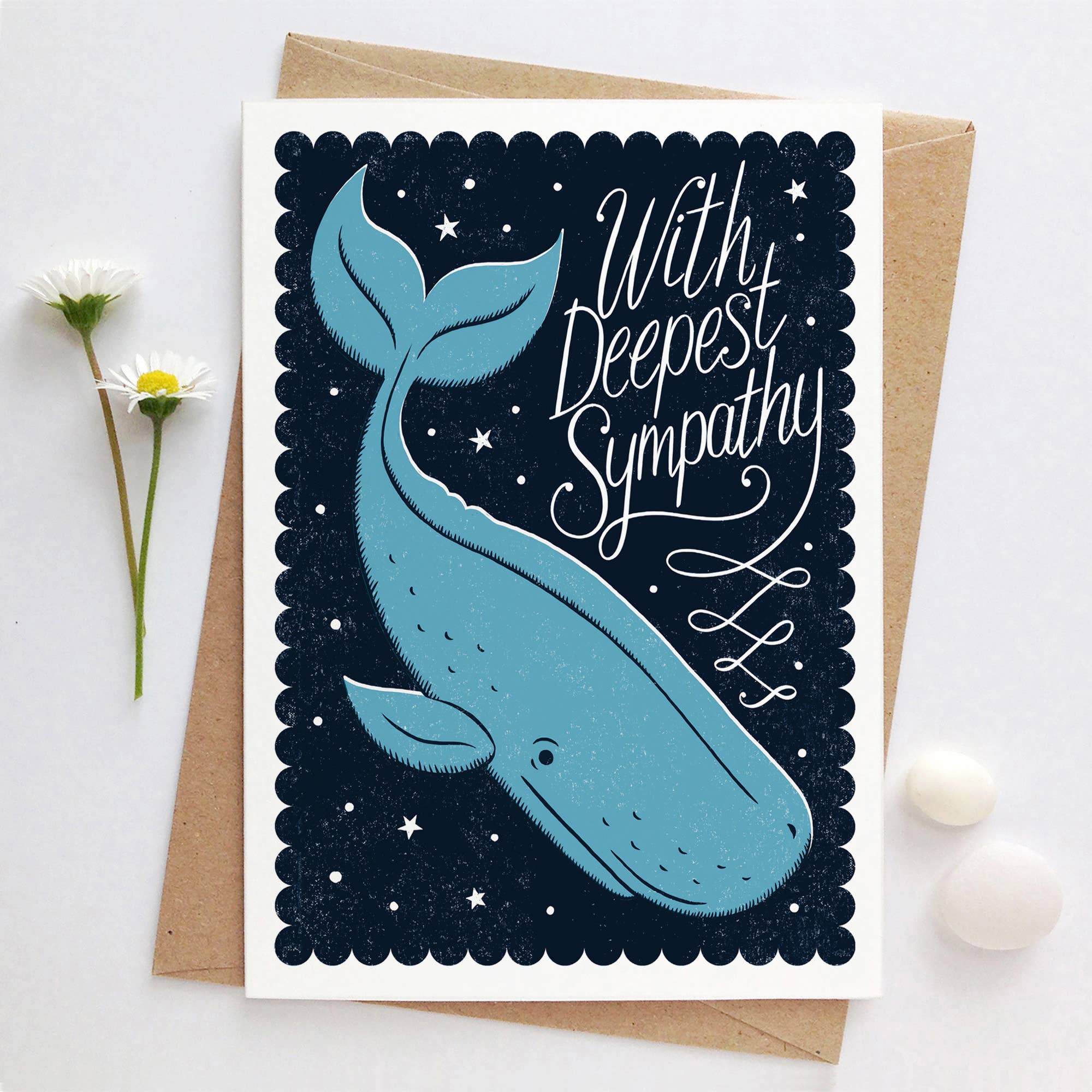 Sympathy card with whale illustration and 'With Deepest Sympathy' text on a white background.