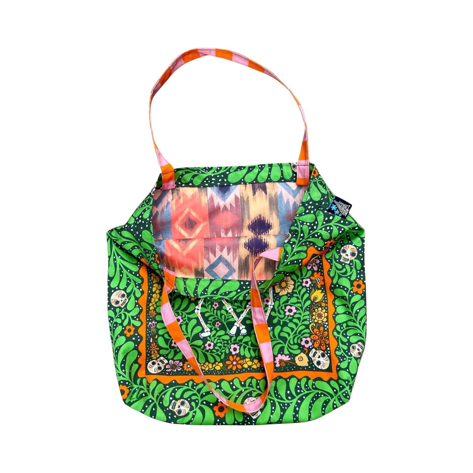 Fabulous tote bag featuring black labradors, orange dachshunds and green scottie dogs with green leaves and a lilac background with orange and white checked cotton handles.