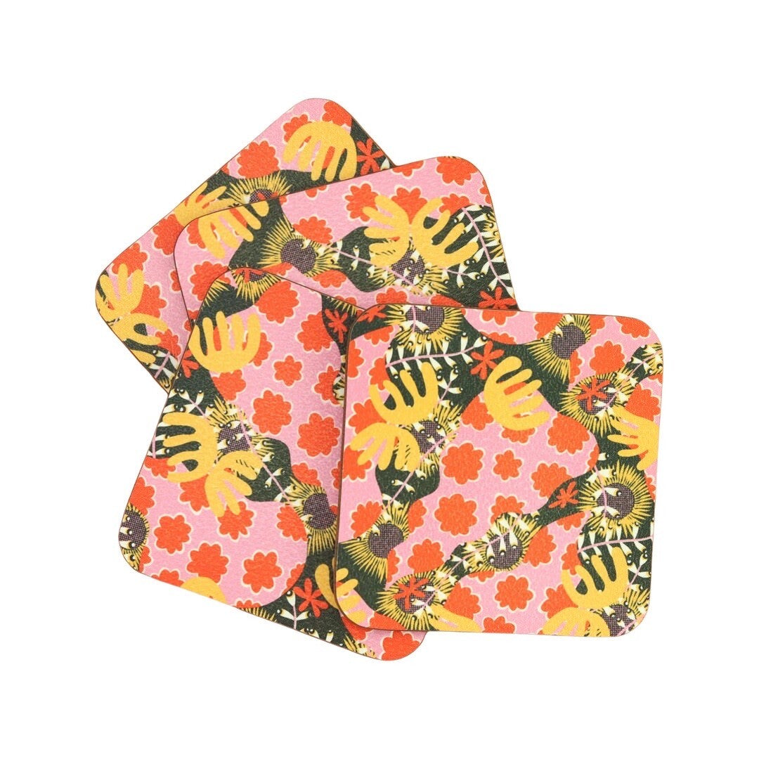 A 4 pack of abstract botanical coasters in a red, pink and yellow design.