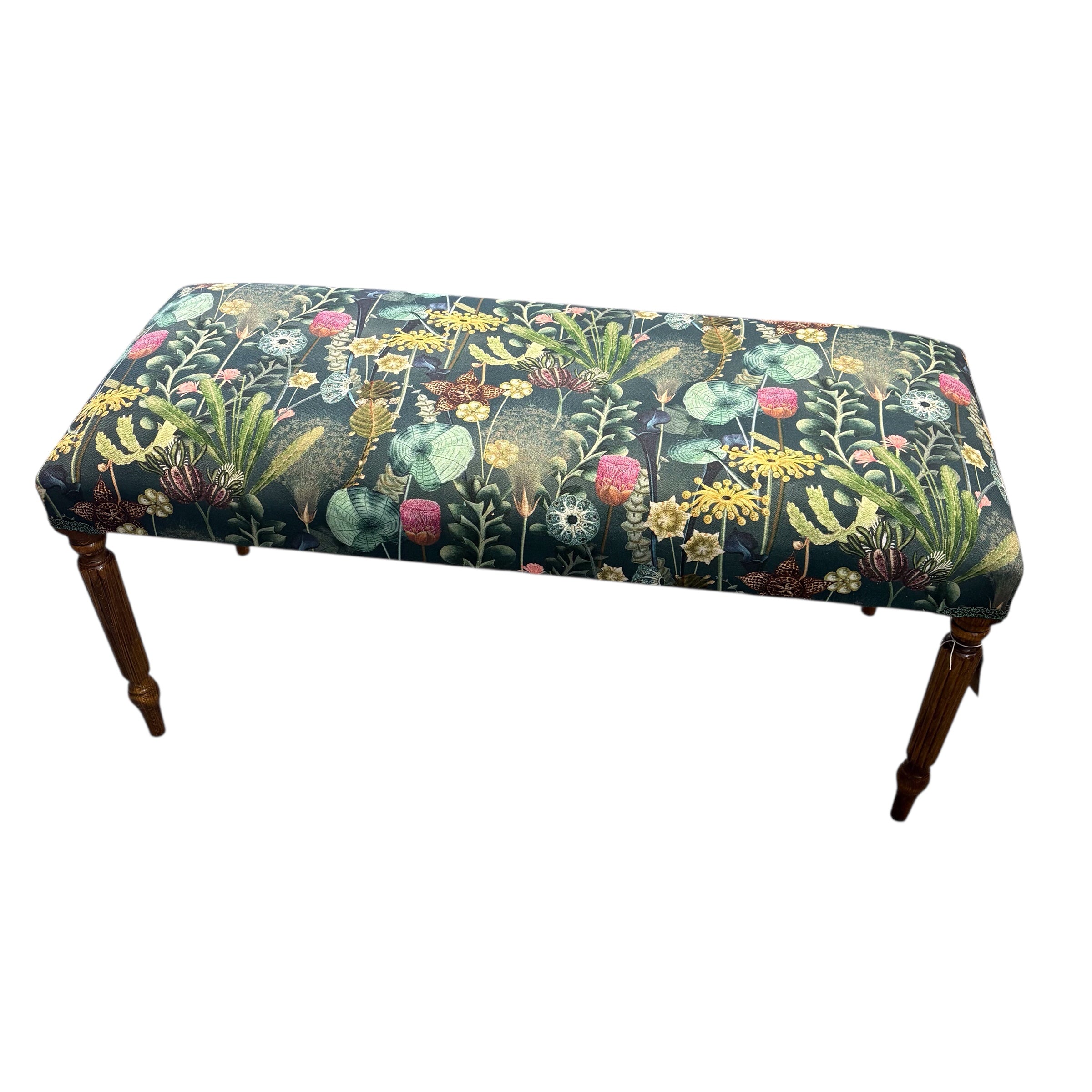 A beautiful hand crafted occasional bench, perfect for any lounge, conservatory or bedroom. Covered in a dark green cotton featuring a botanical scene in dark green fabric with mahogany stained legs. 