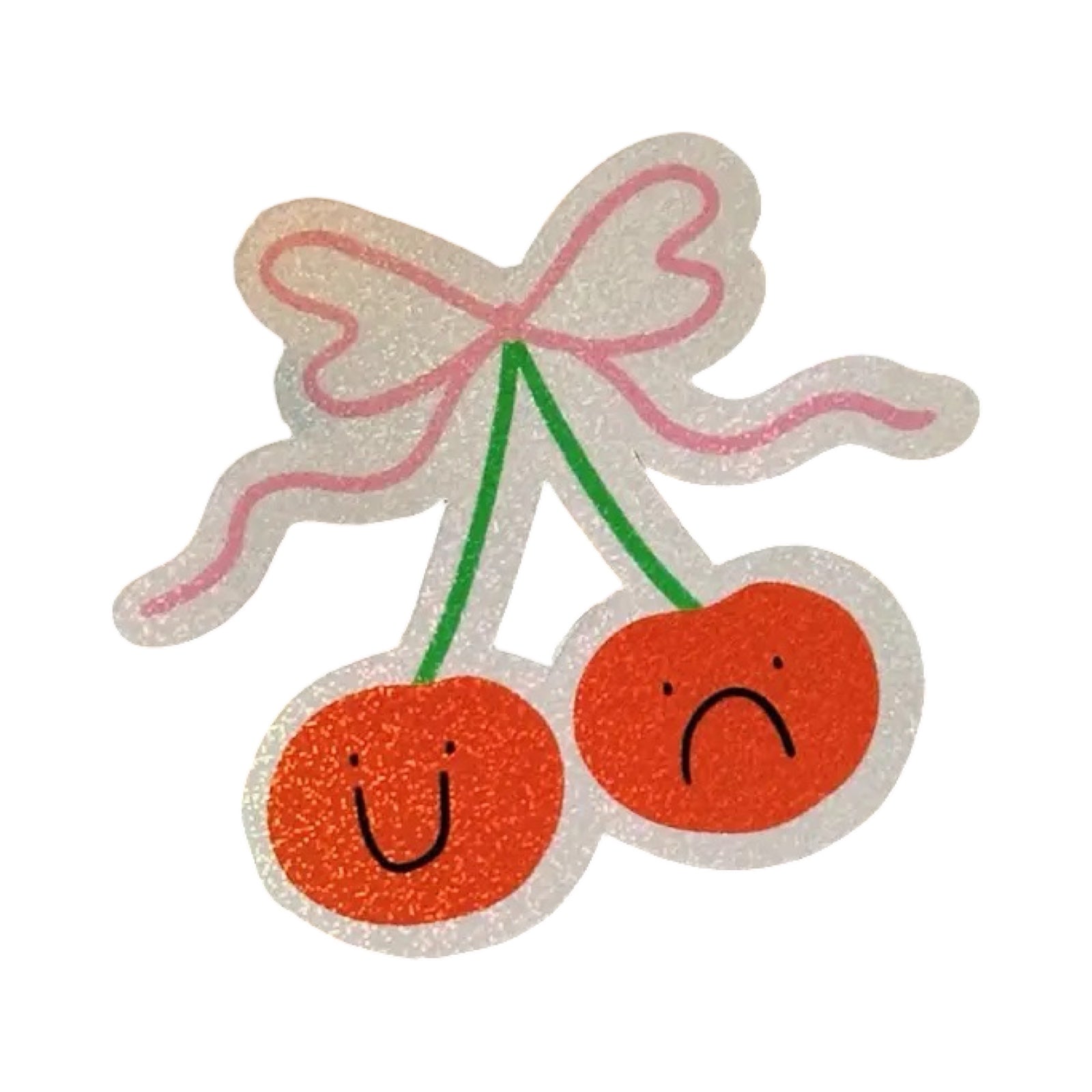 A waterproof halo glitter vinyl sticker of a pair of cherries (one happy, one sad) tied with a pink box.