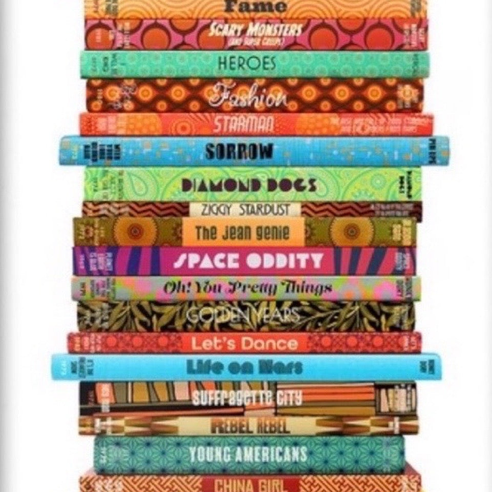 Stack of books with colorful covers on a white background.