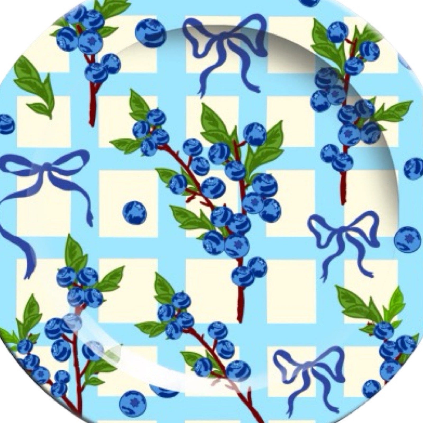 Decorative plate with blueberries and ribbons on a checkered background.