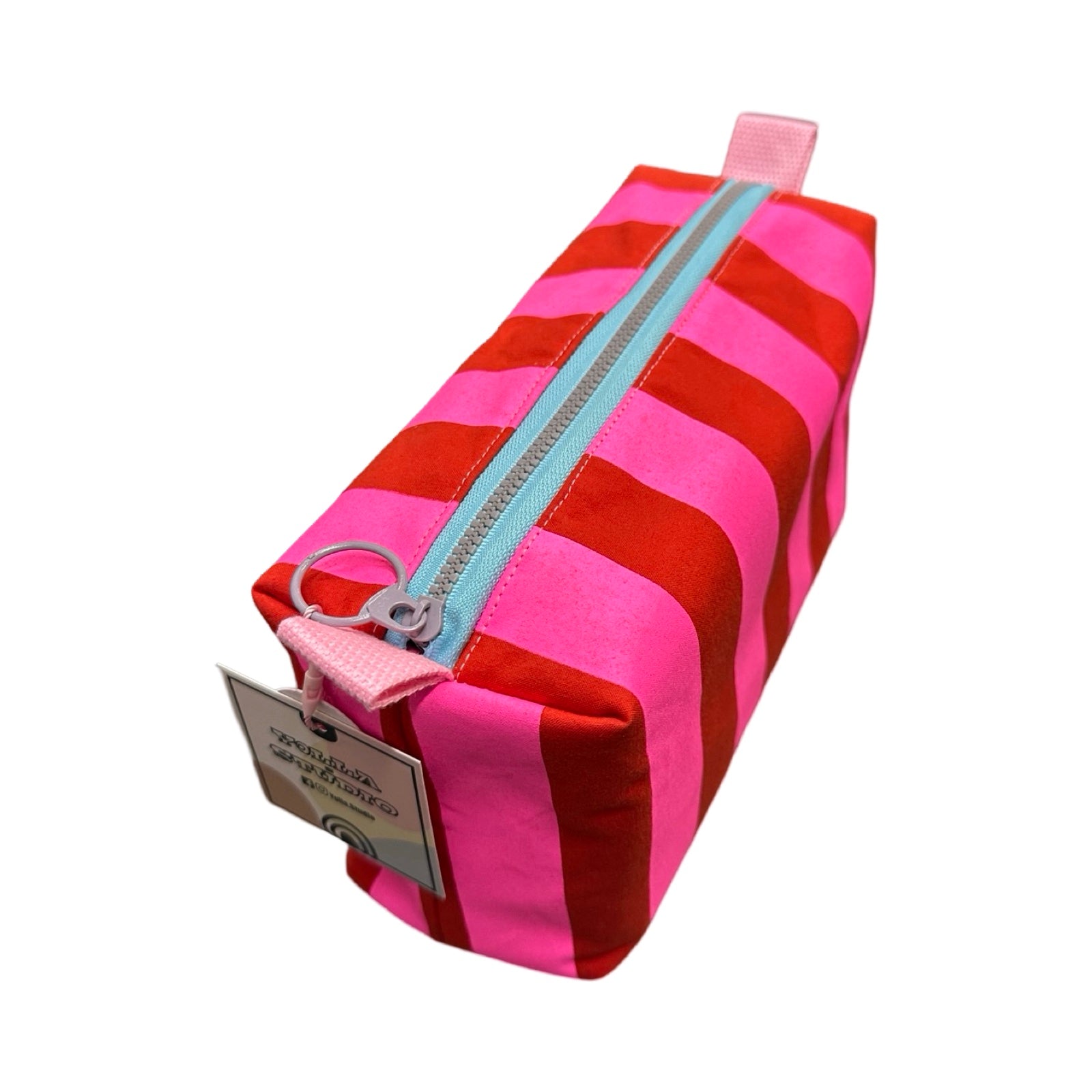 A boxy cosmetic bag in red and bright pink stripes.