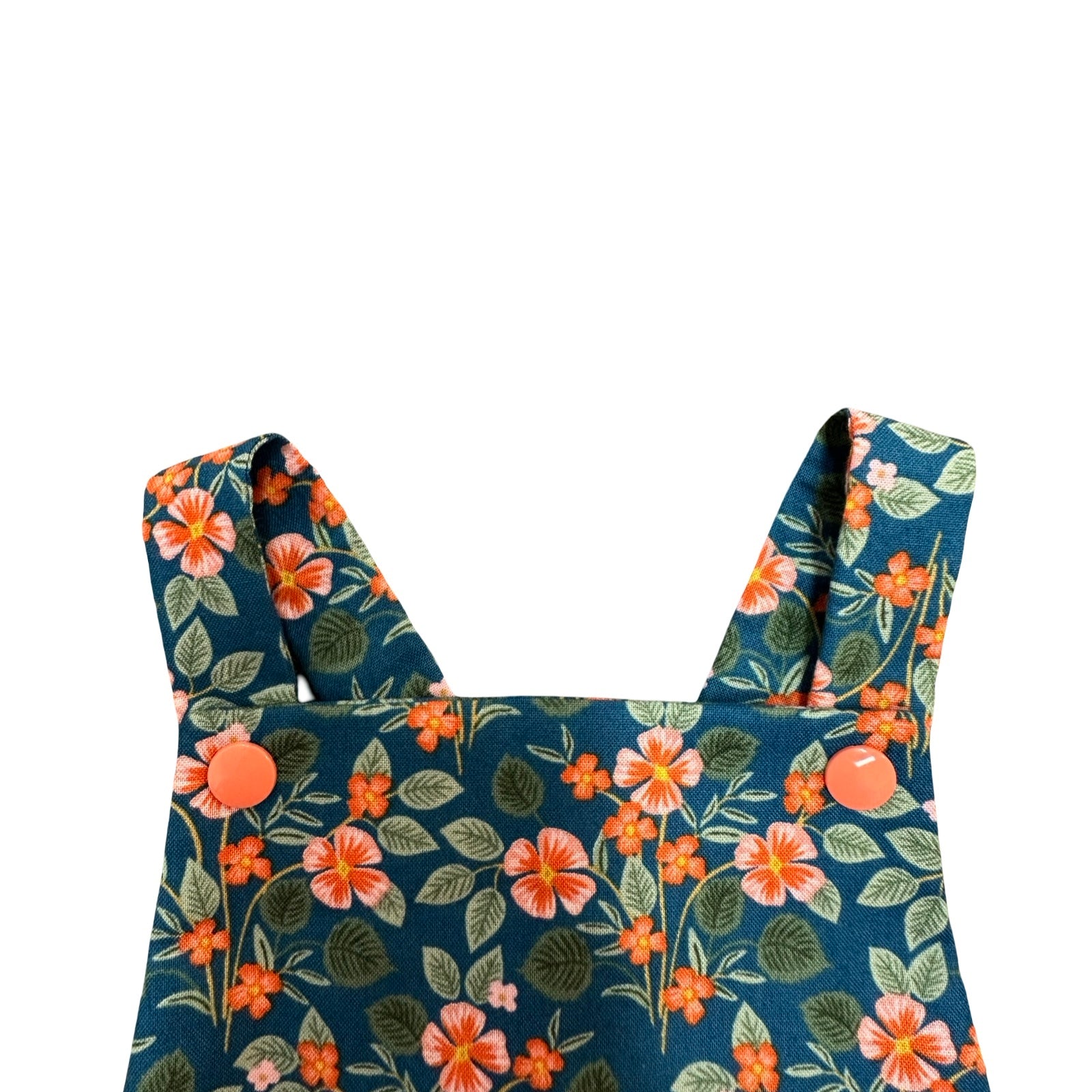 Floral-patterned romper straps on a white background.