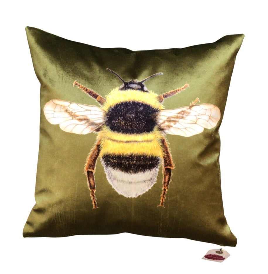 Olive green velvet cushion with a bumblebee on the front.