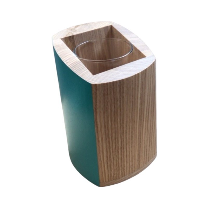 Top of a wooden vase with glass insert and teal sides.