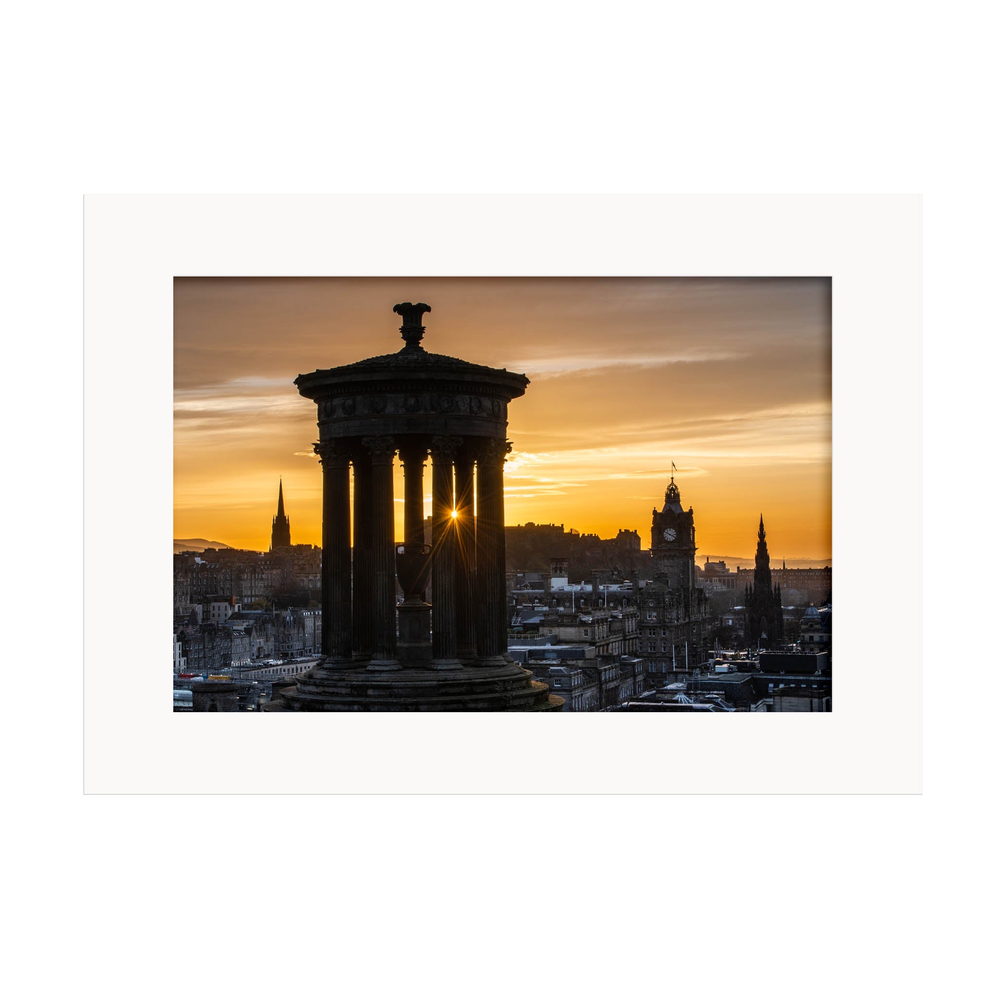An image of the Edinburgh Skyline at sunset in a white mount.
