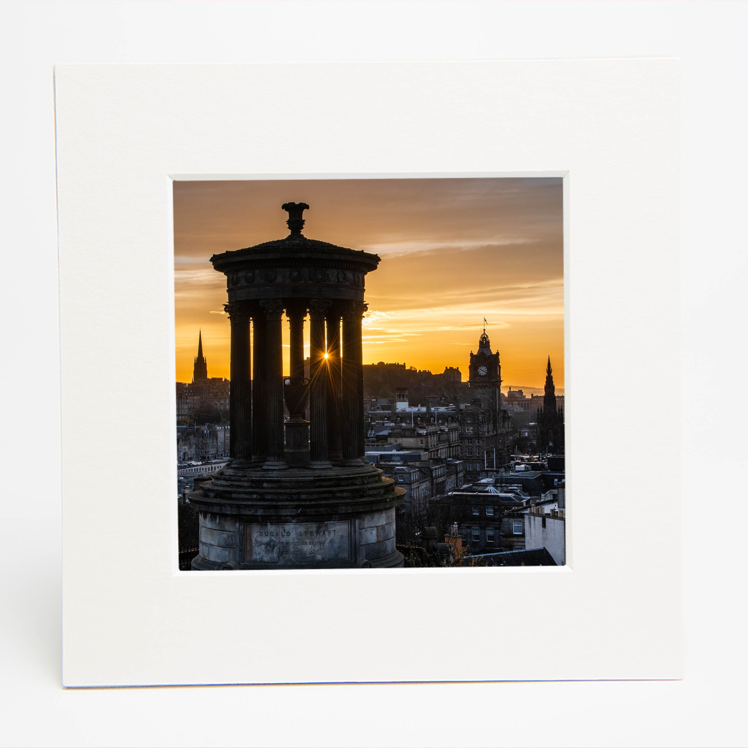 An image of the Edinburgh skyline from Calton Hill in a white square mount.