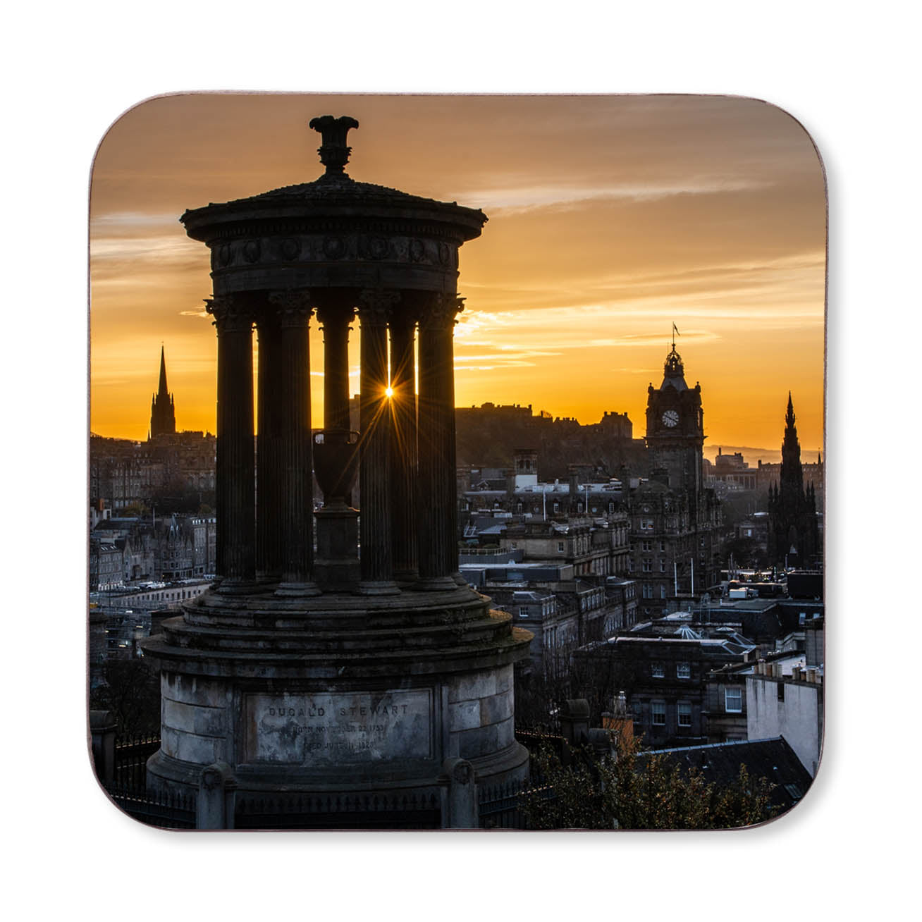 An image of the Edinburgh skyline at sunset on a coaster.